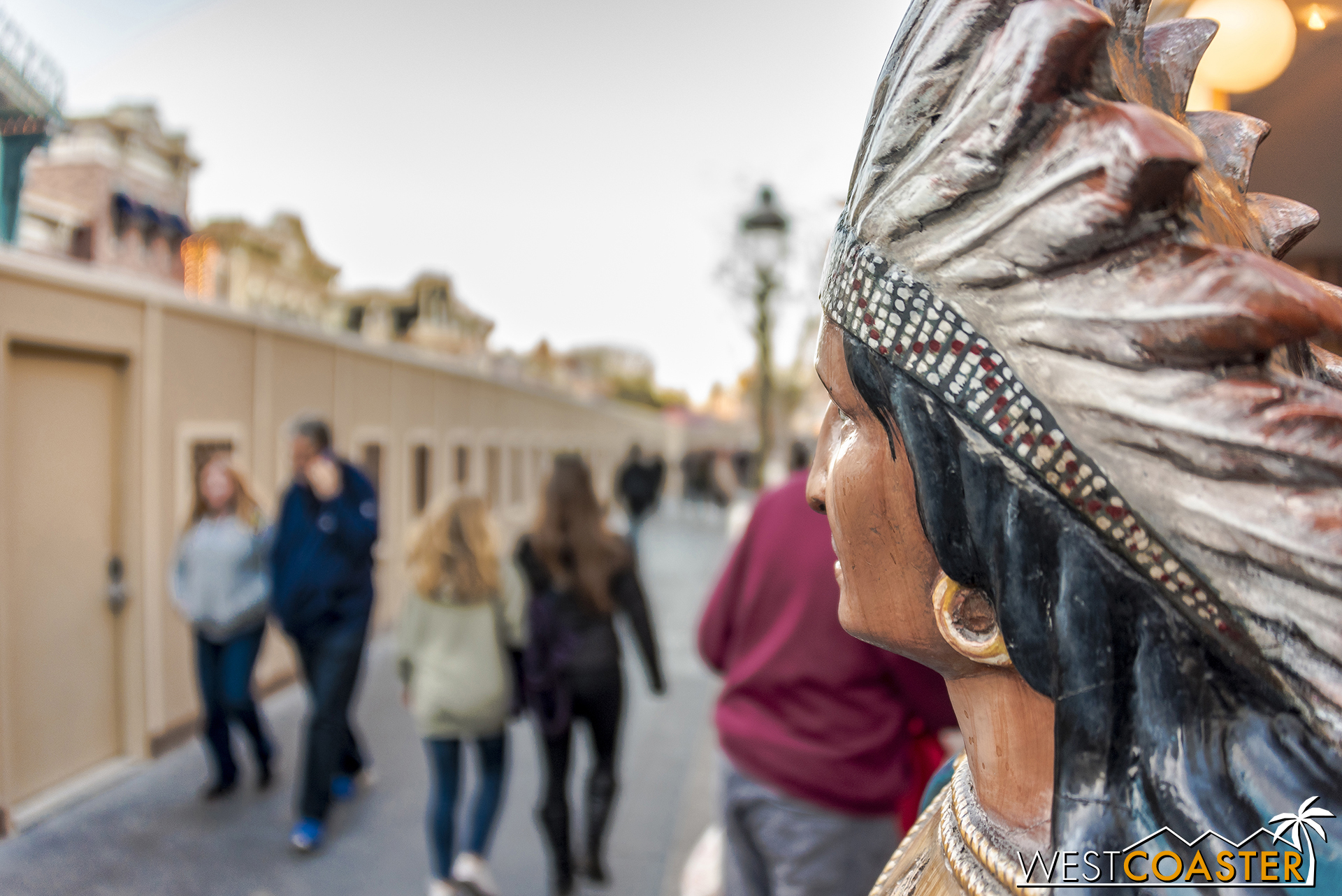 The Main Street Indian looks on at the walls blocking his view.