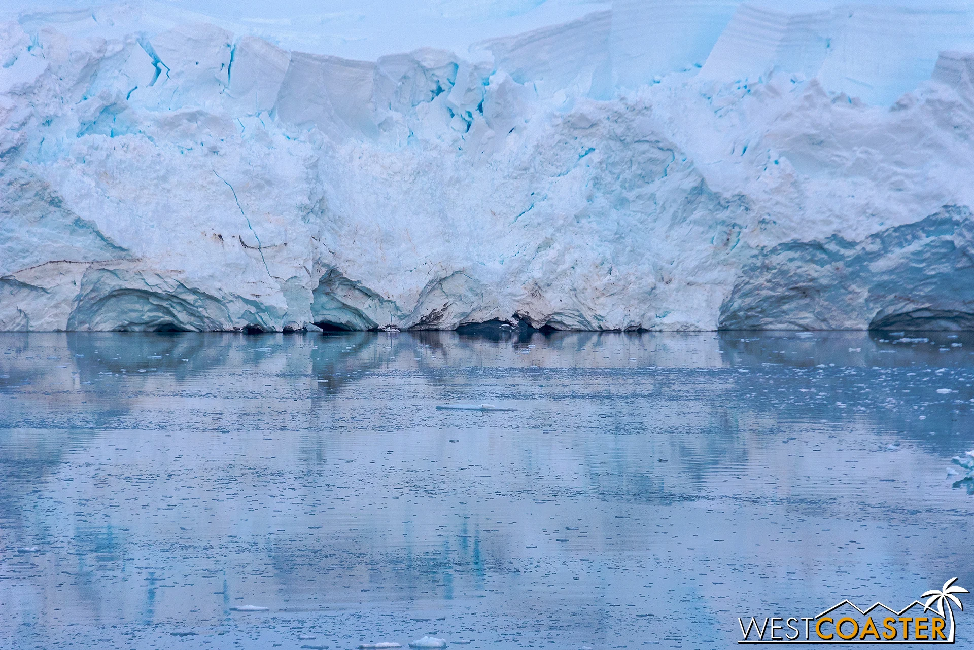 Reflections at the edge of the ice and water.