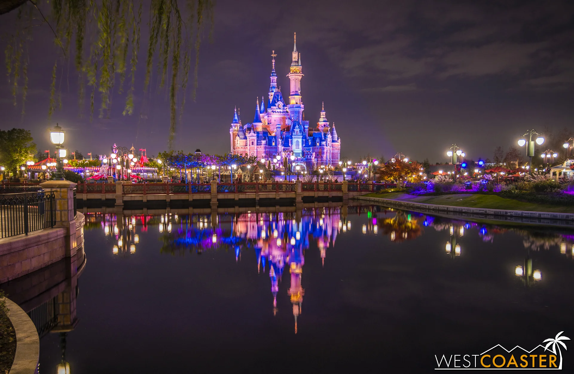 The Enchanted Storybook Castle reflects off one of many ponds throughout the Gardens.