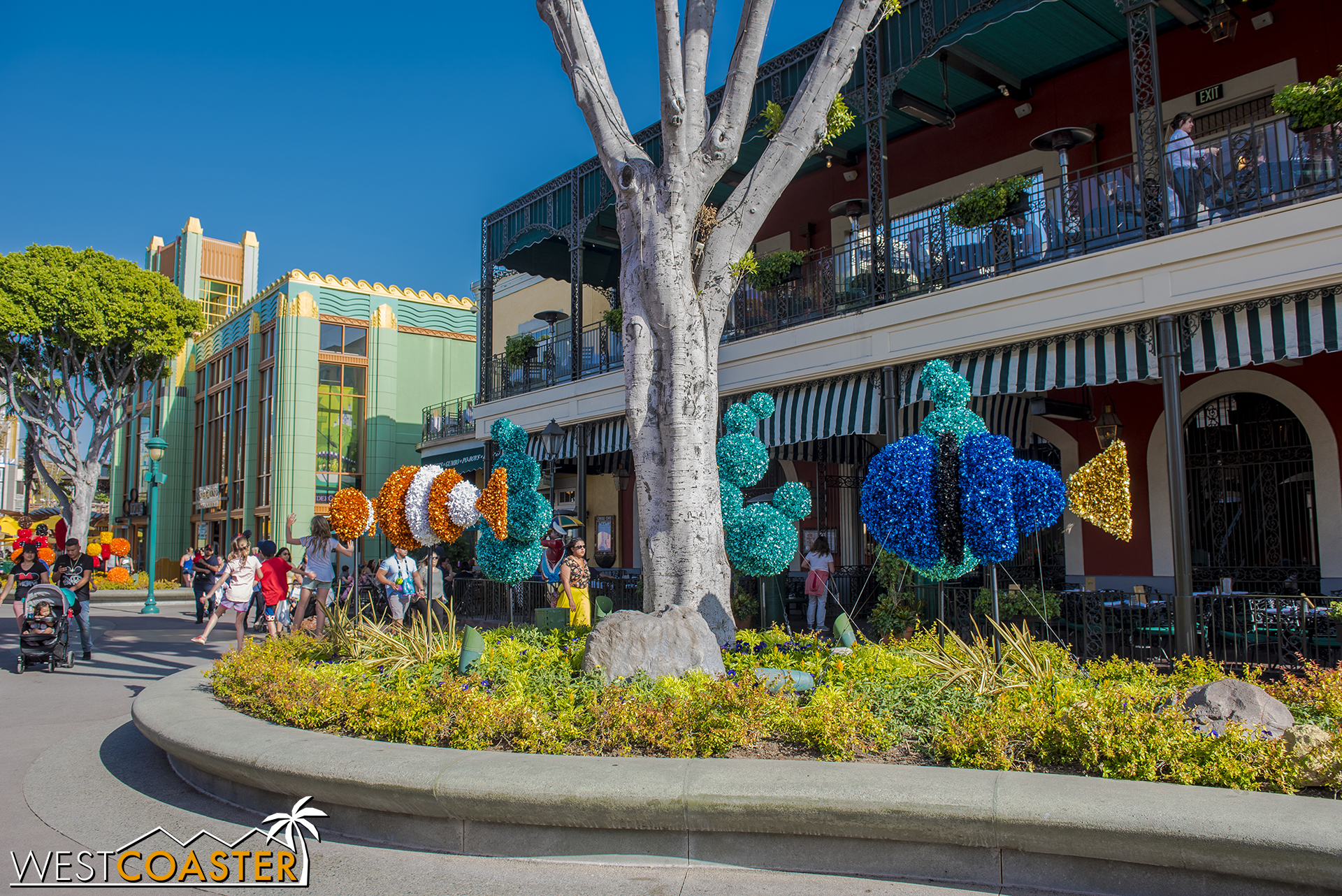  In Downtown Disney, they’re accompanied by these tinsel-y Pixar figures. 