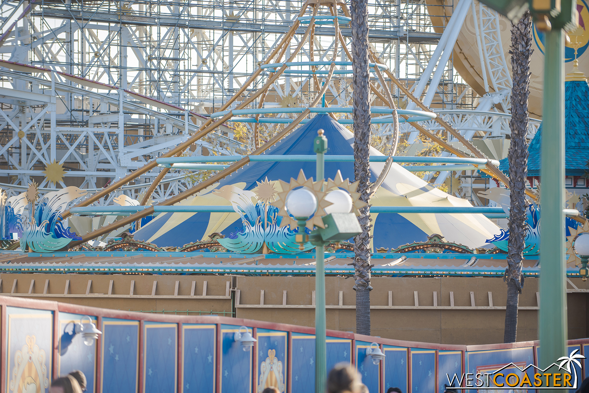  That will make the ride less open, though.  But perhaps the inside of the wall will have a fun painting or perhaps animation or zoetrope effect for guests circling by? 