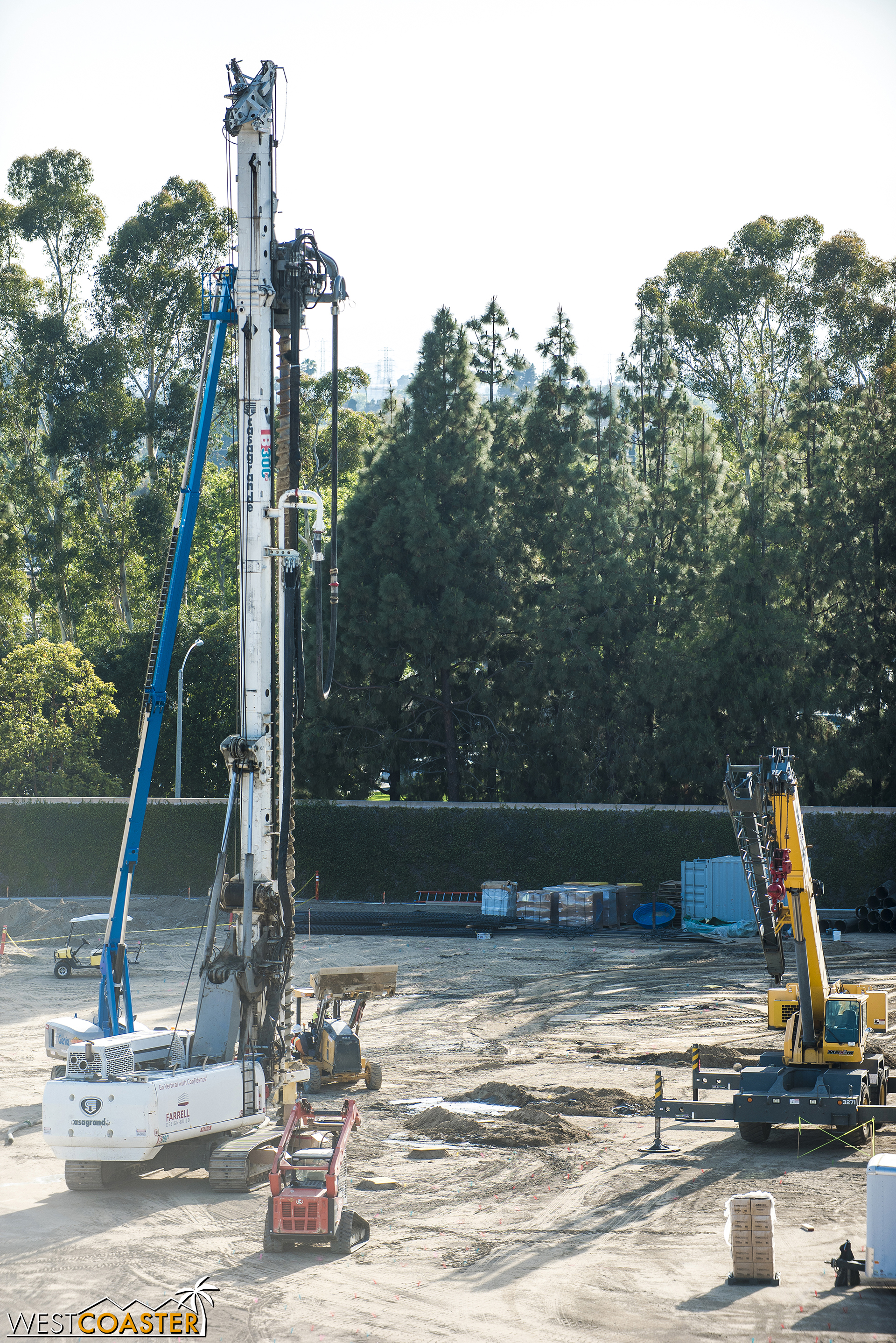 This is a pile driver. It pounds the ground hard, creating a deep, dark hole that will eventually receive a rock hard shaft (caisson).