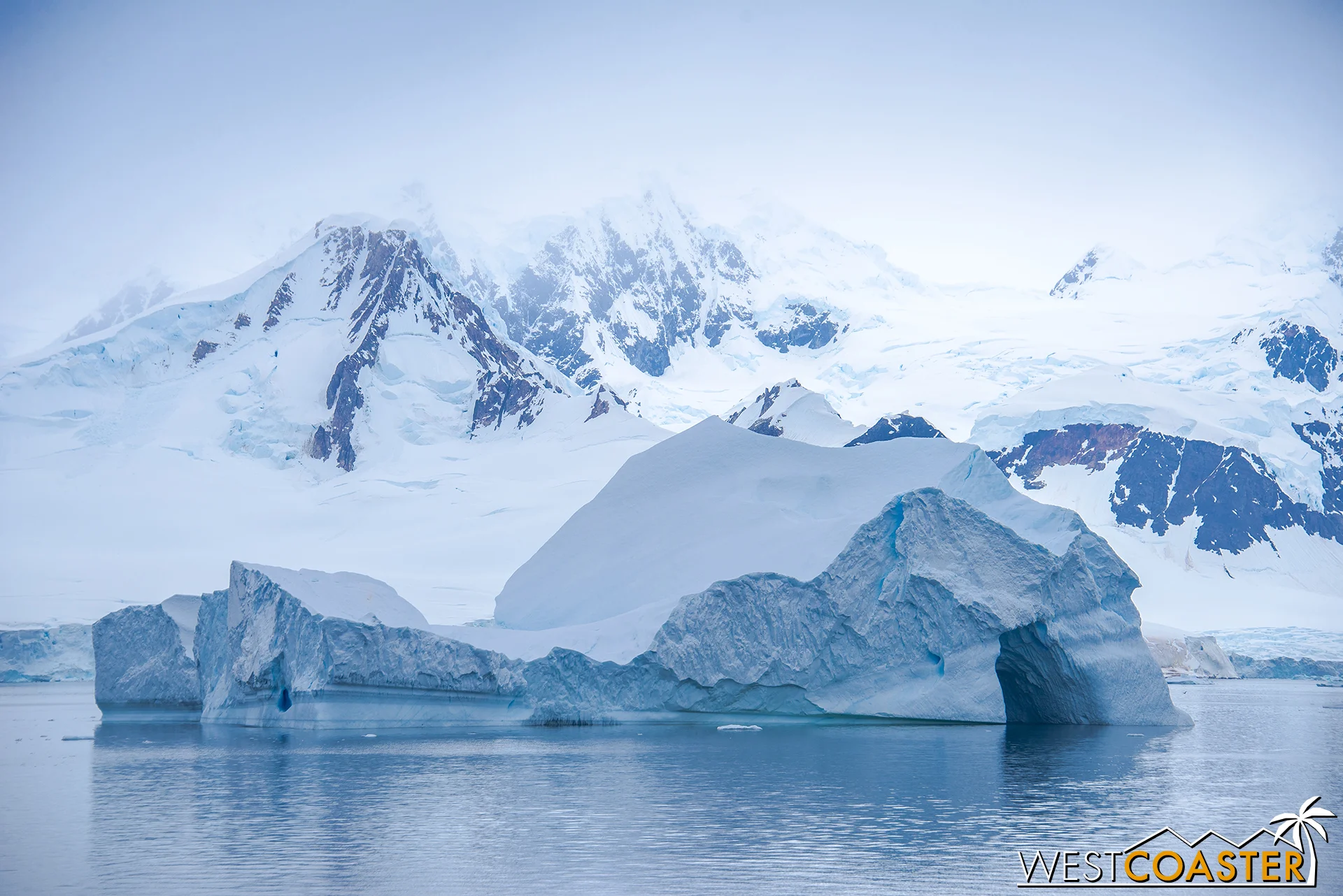 Cavernous icebergs float by as the Ocean Diamond continues its journey.