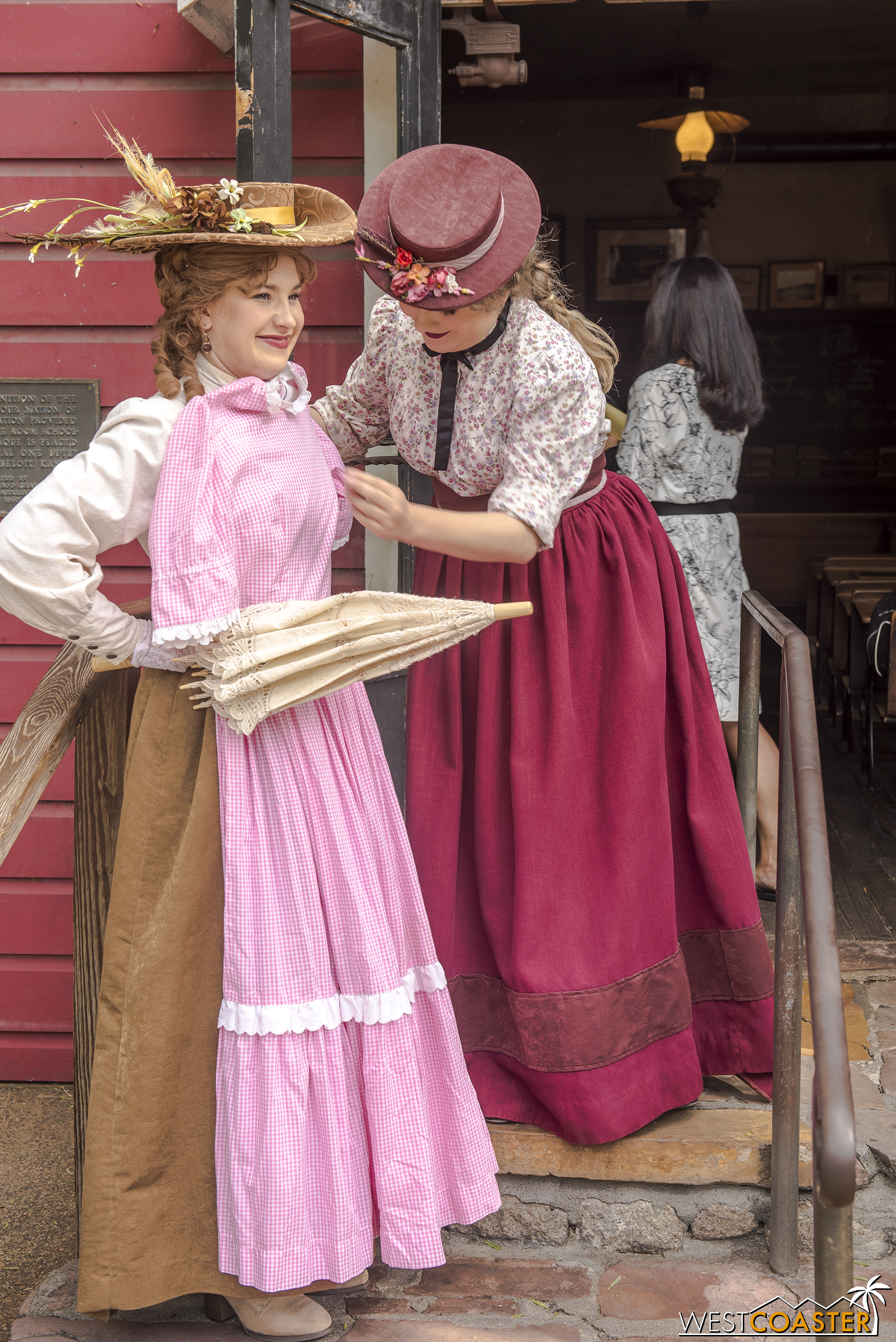 In the meantime, she tries out a dress on her friend, Violet Lee, for wear in the upcoming celebration.
