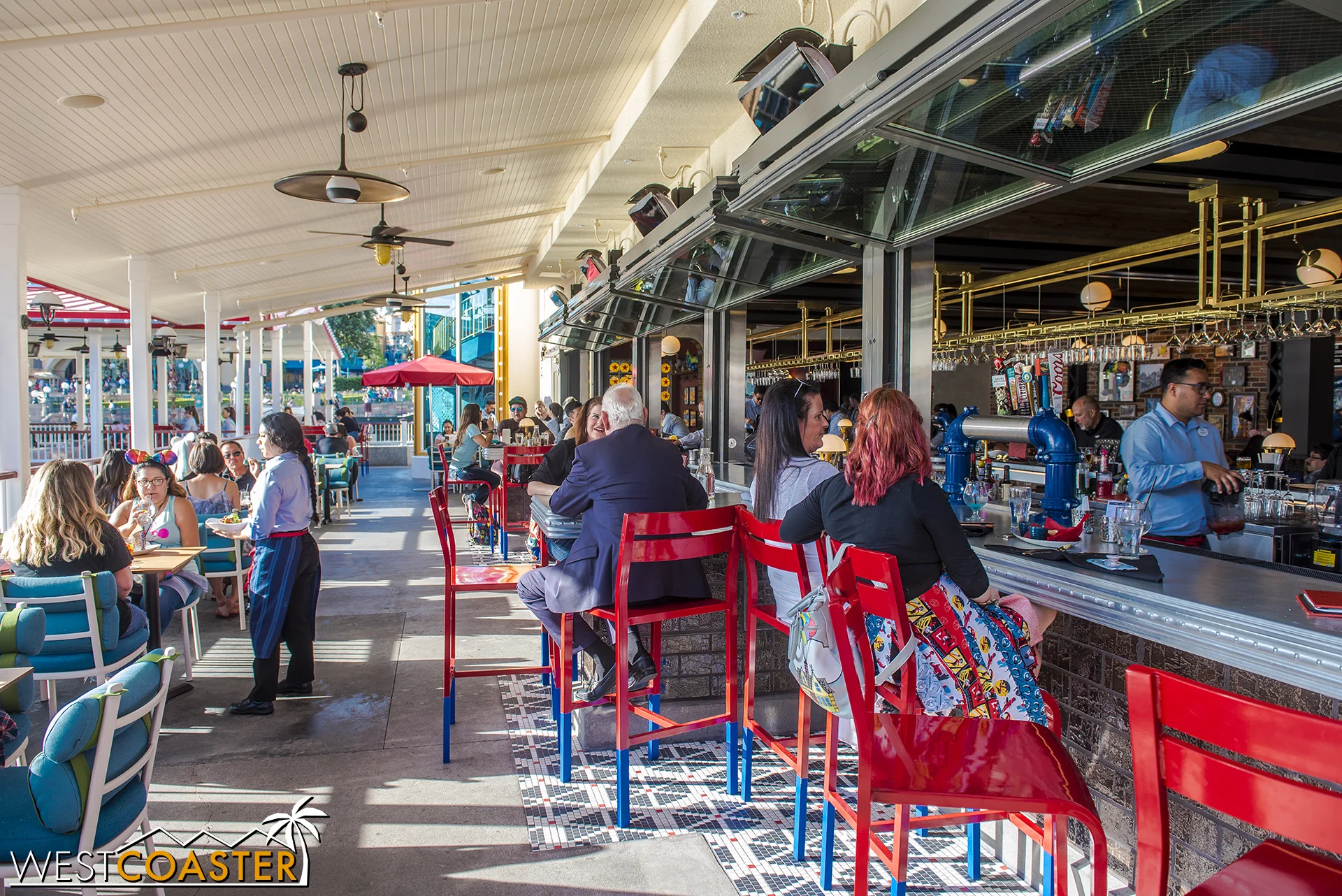  On the outside, these bifolding counter windows open up the bar to serve exterior patrons. 