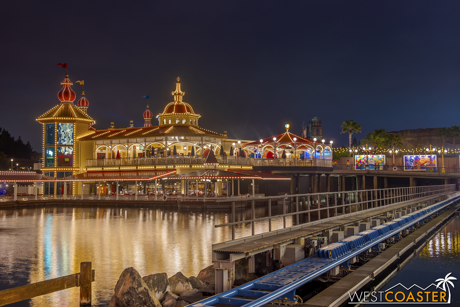  At night, the water effect is light up in red as the roller coaster train launches. 