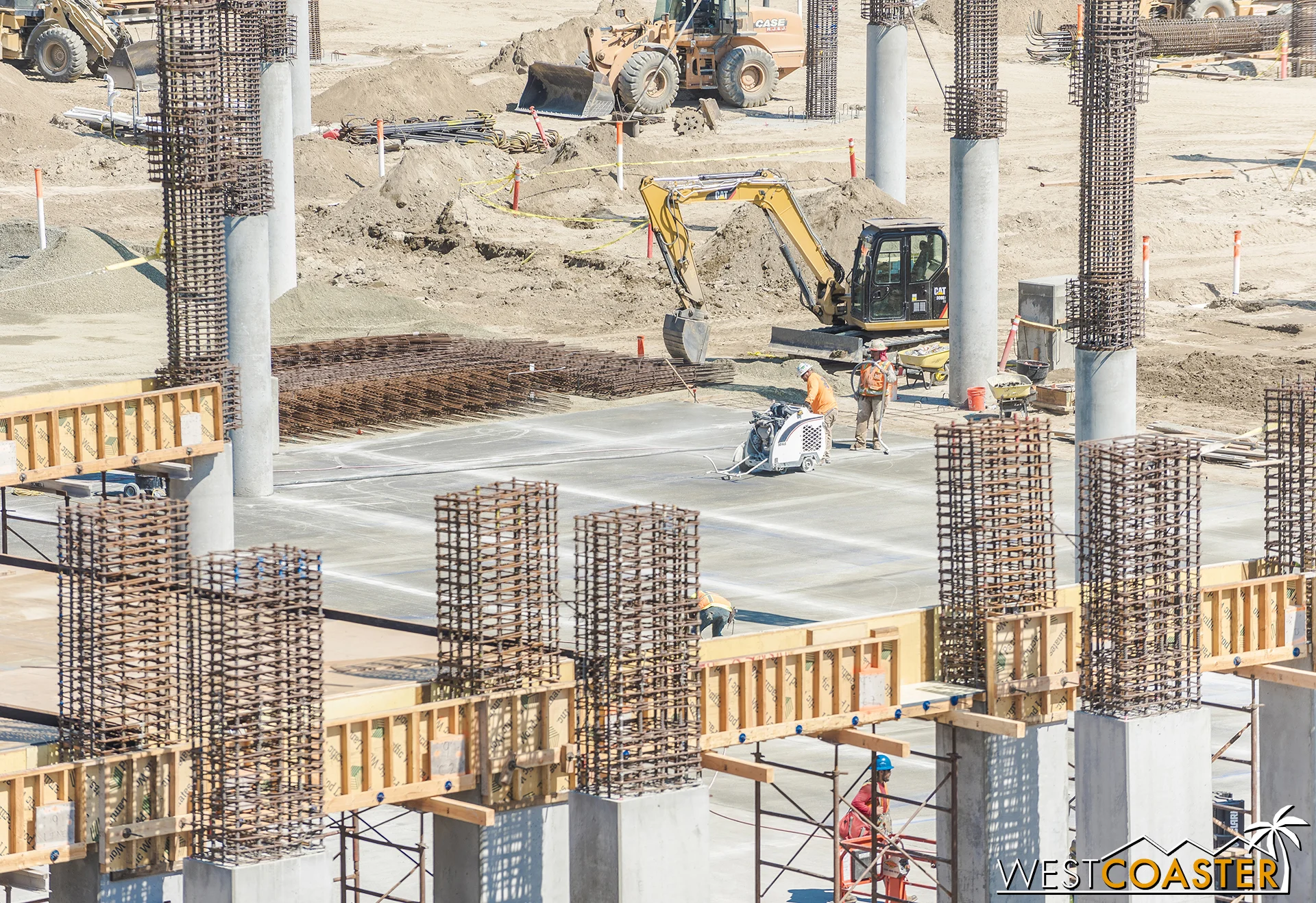 The ground floor is getting vehicular concrete in some areas too. This guy was cutting control joints scored into the ground.