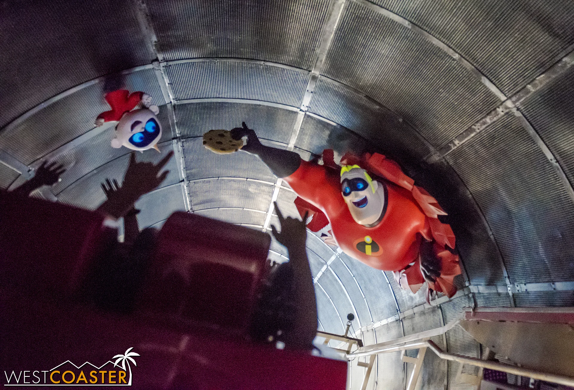 Especially from the back car, Mr. Incredible offering Jack Jack cookies flies by way too quickly to be noticed.