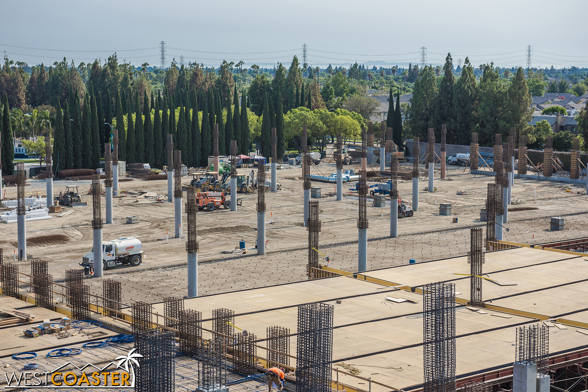  In the distance, we can see ladders and rebar being set for more ground level concrete paving. 