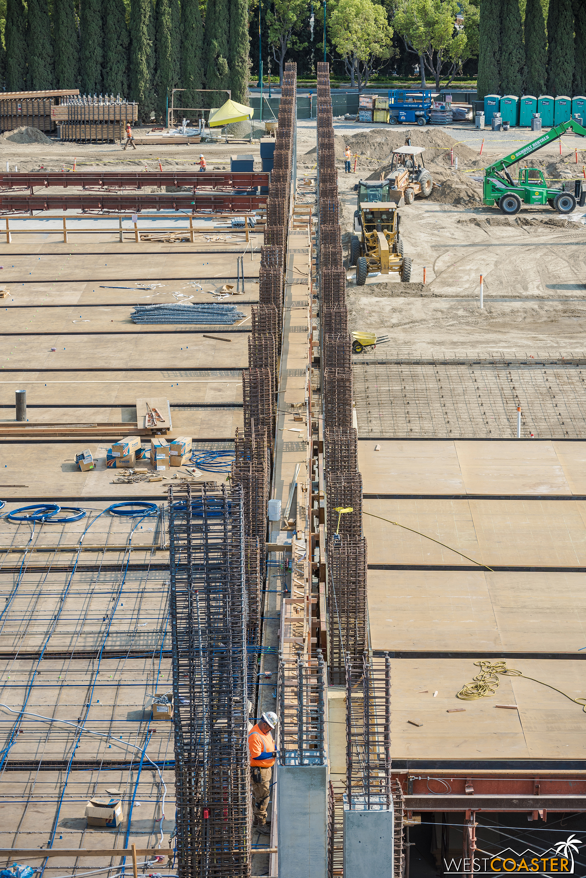  Down the line of the seismic separation again, with more rebar.  Rebar gives concrete reinforcement and helps it behave strongly in tension; the concrete itself is very strong in compression.  Together, they form a durable and flexible structural fr