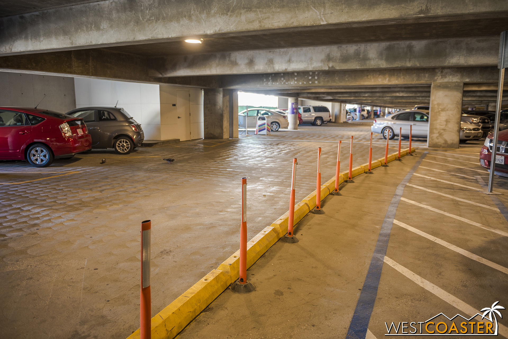  It looks like vehicles will need to take this merge onto this row to come back to the original structure and eventually exit out the ramps onto Disneyland Drive. 