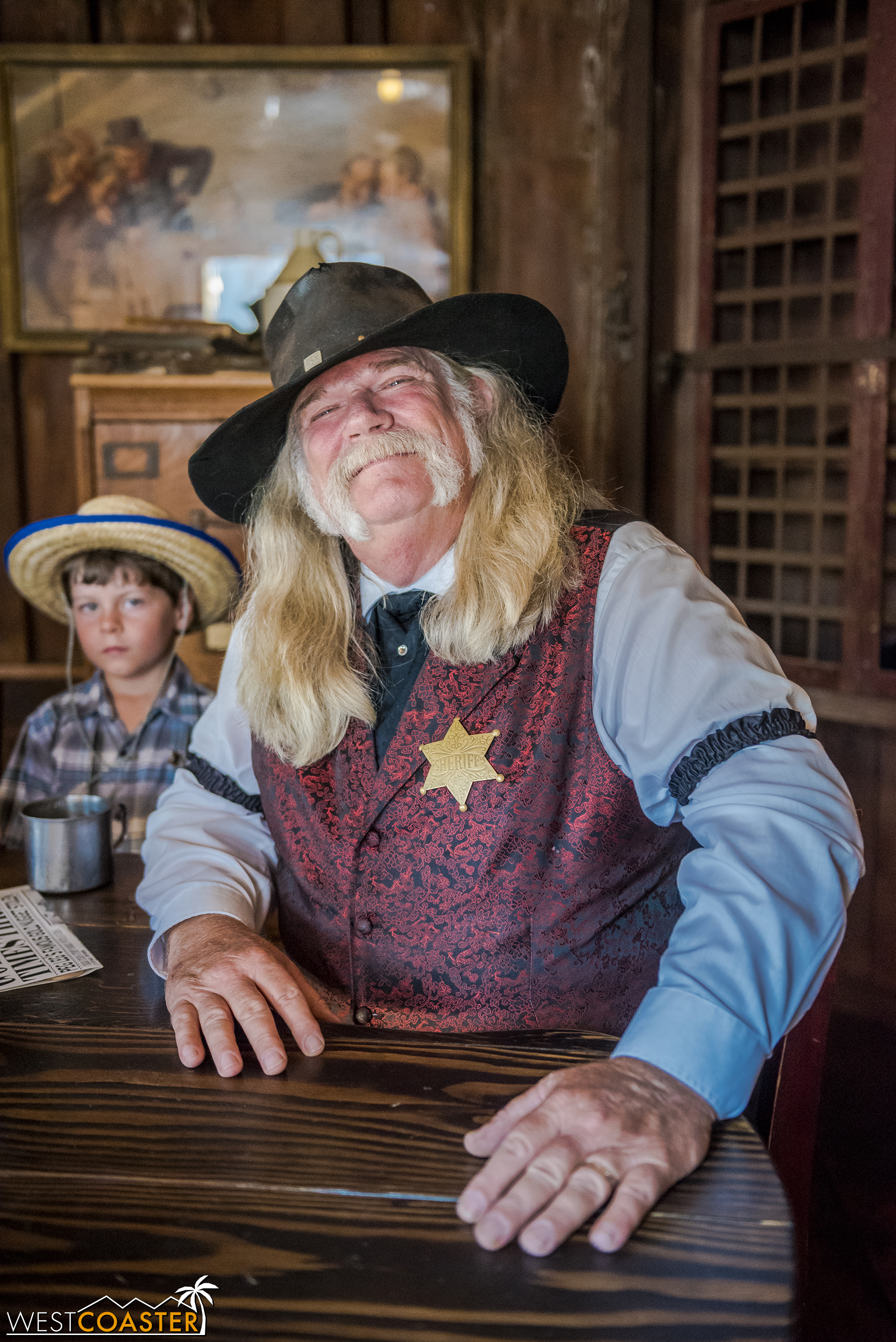  Of course, Sheriff Bryce Wheeler is around as always.  On this day, he’s waiting for a stagecoach to arrive carrying his date to the Founder’s Day Hoedown, Goldie West.  Unfortunately, the stagecoach has been delayed by three days, much to many peop