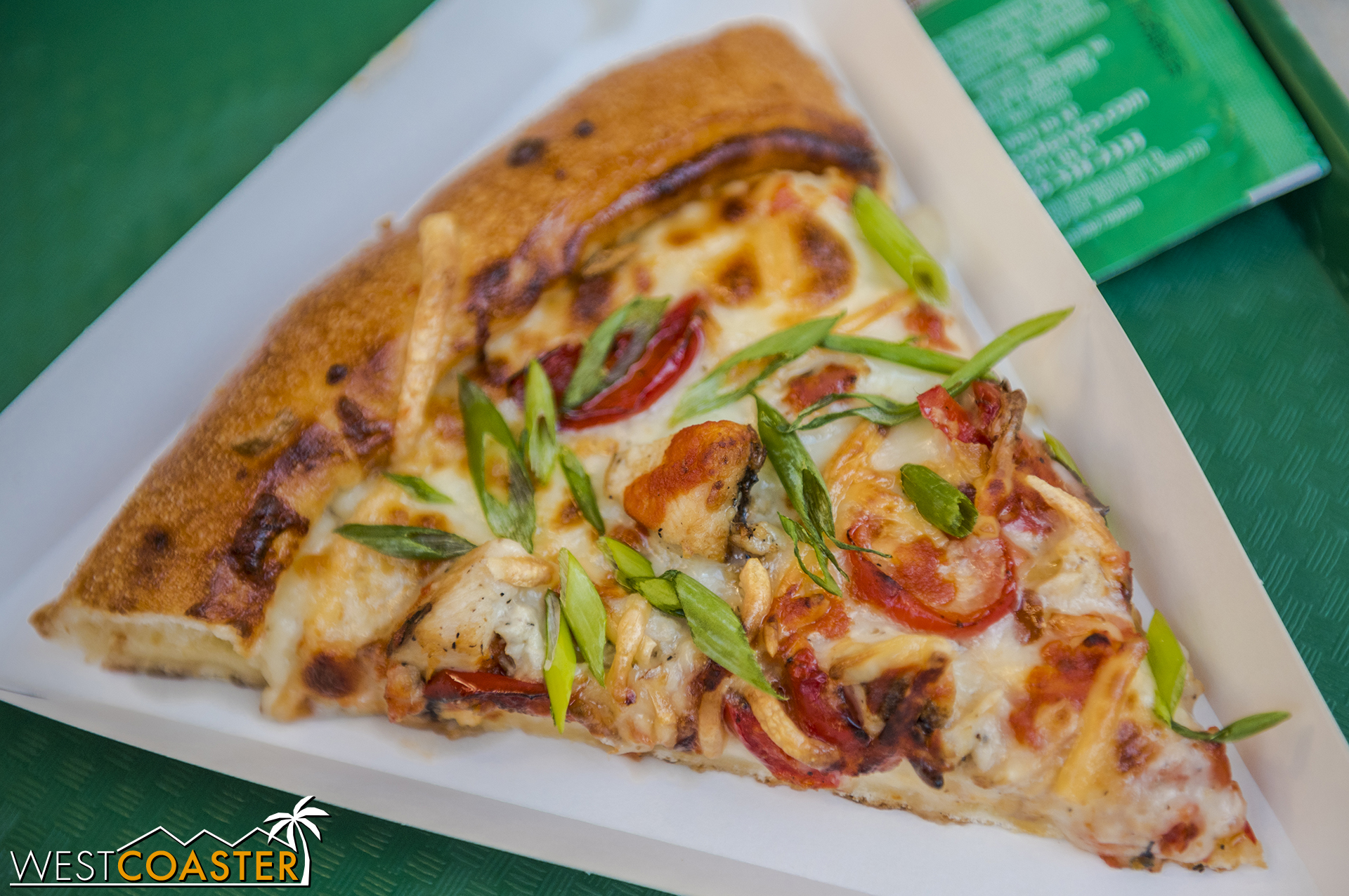  The Anti-Vampire Pizza has roasted garlic sauce, marinated chicken, smoked Gouda, mozzarella, roasted red peppers and a tomato-harissa sauce drizzle.  And green onions.  I’m not sure I got any chicken, but the pizza is still very savory and deliciou