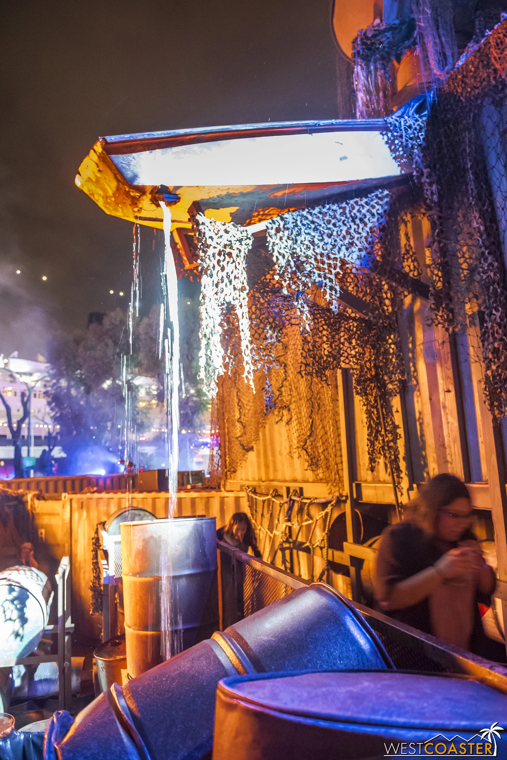 Guests who turn left at a fork in the maze can go up a short “obstacle course” consisting of a climbing net going up and a slide or pole going down.