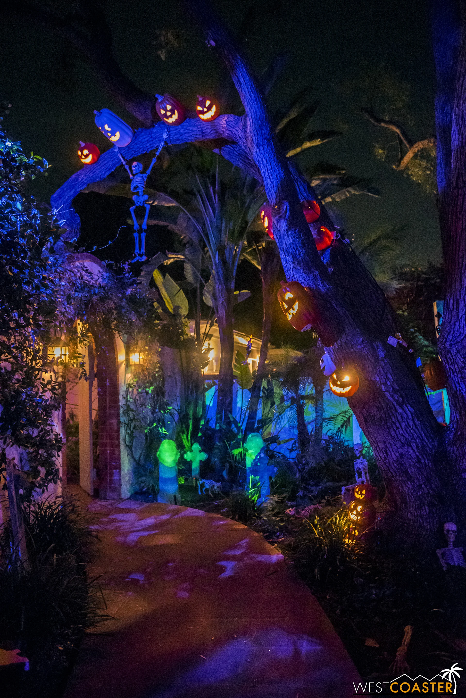 A lovely walkway leads to Pumpkin Hollow and the home’s entry courtyard.