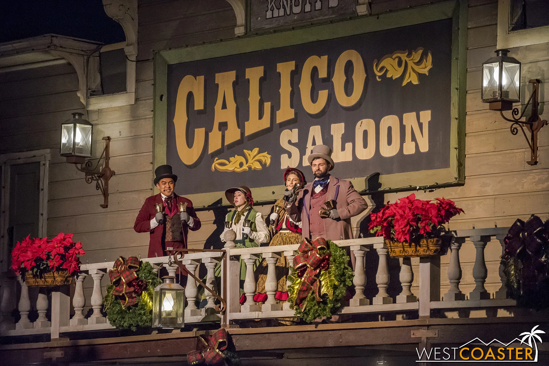 Christmas carolers serenade the crowd before the tree lighting.