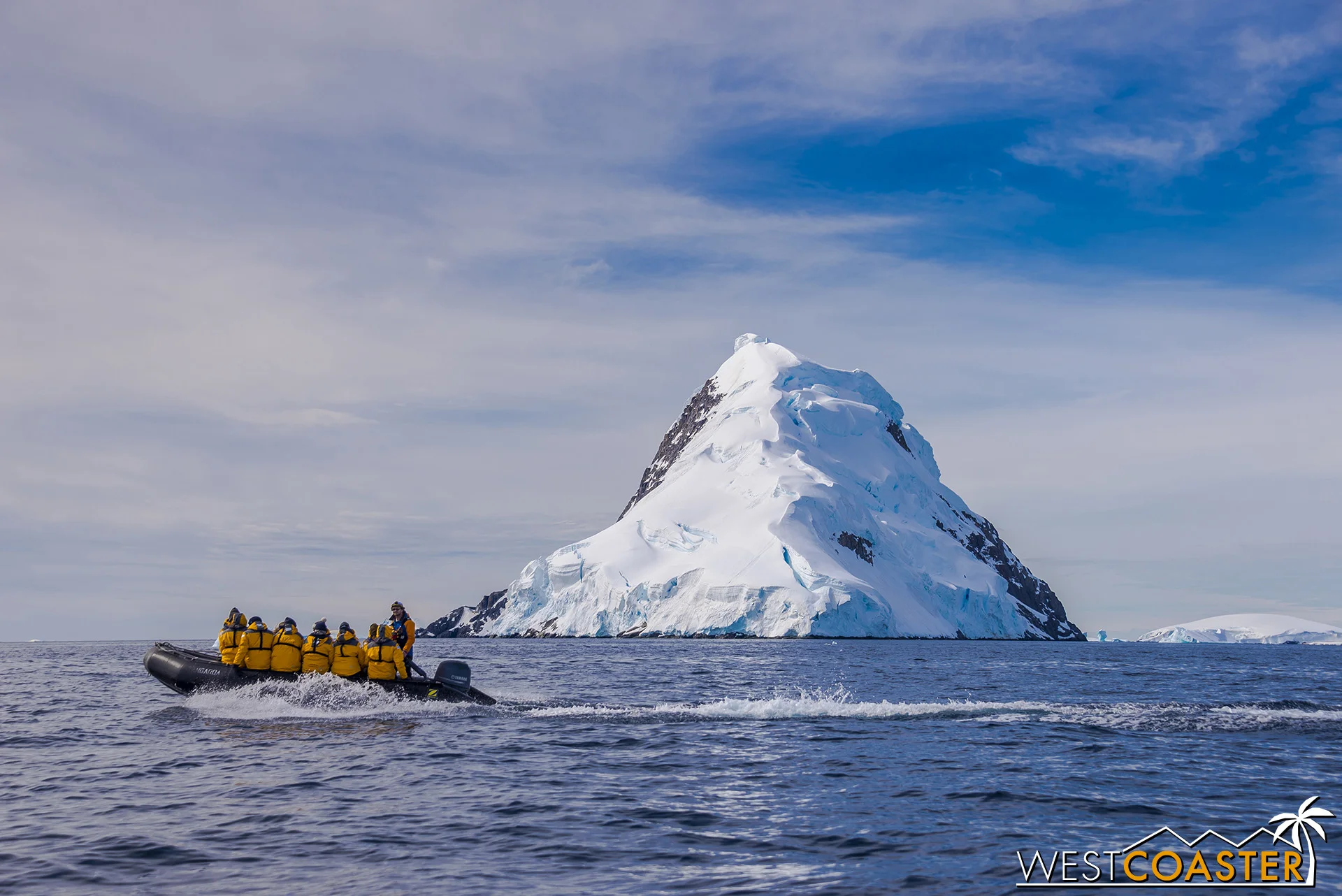 A Quark Expeditions Zodiac boat cuts through the water on our final cruise of our trip.