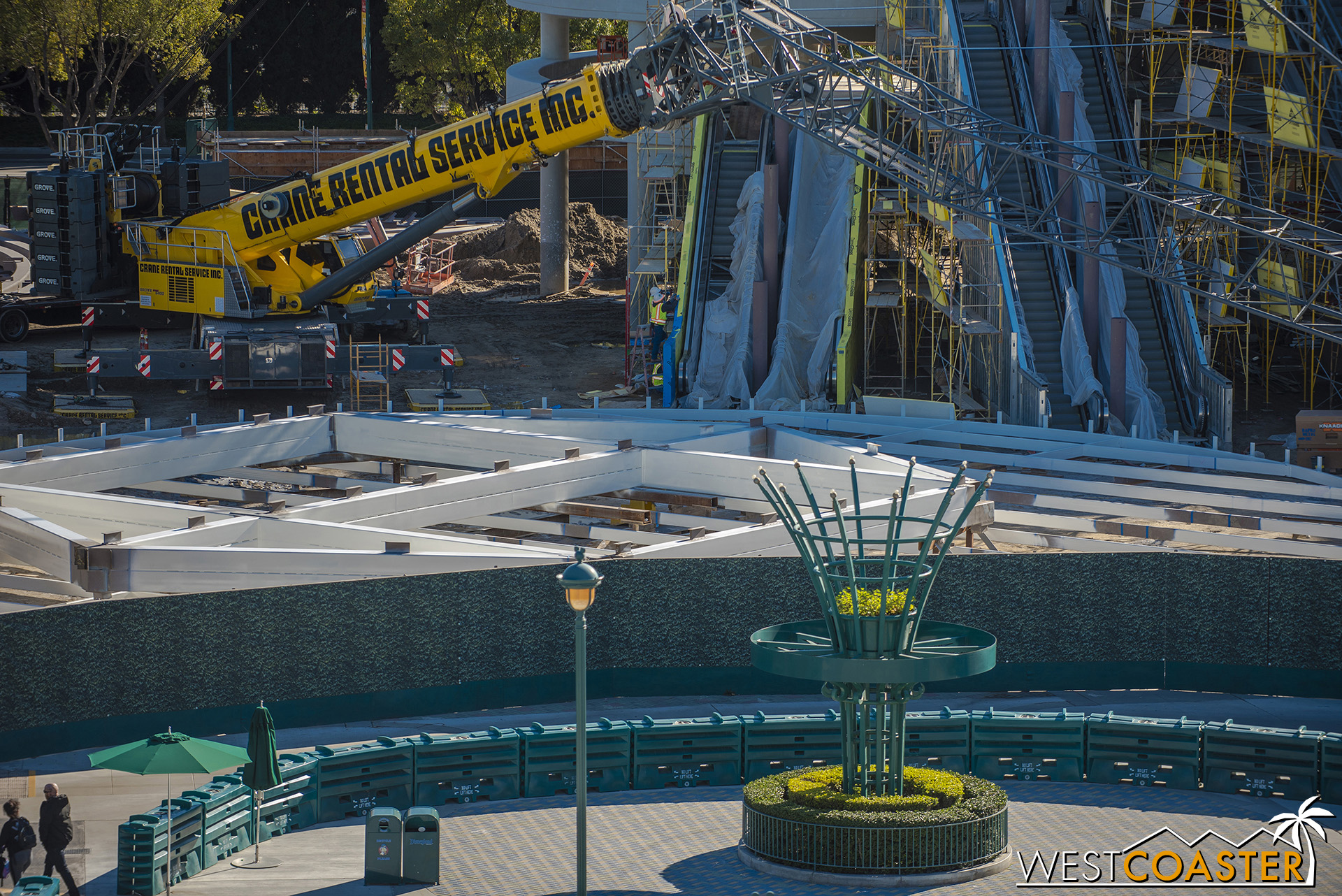  The base of the escalators, and also the escalator promenade topper still lying on the ground, being assembled before it gets hoisted to the top of the sixth floor. 