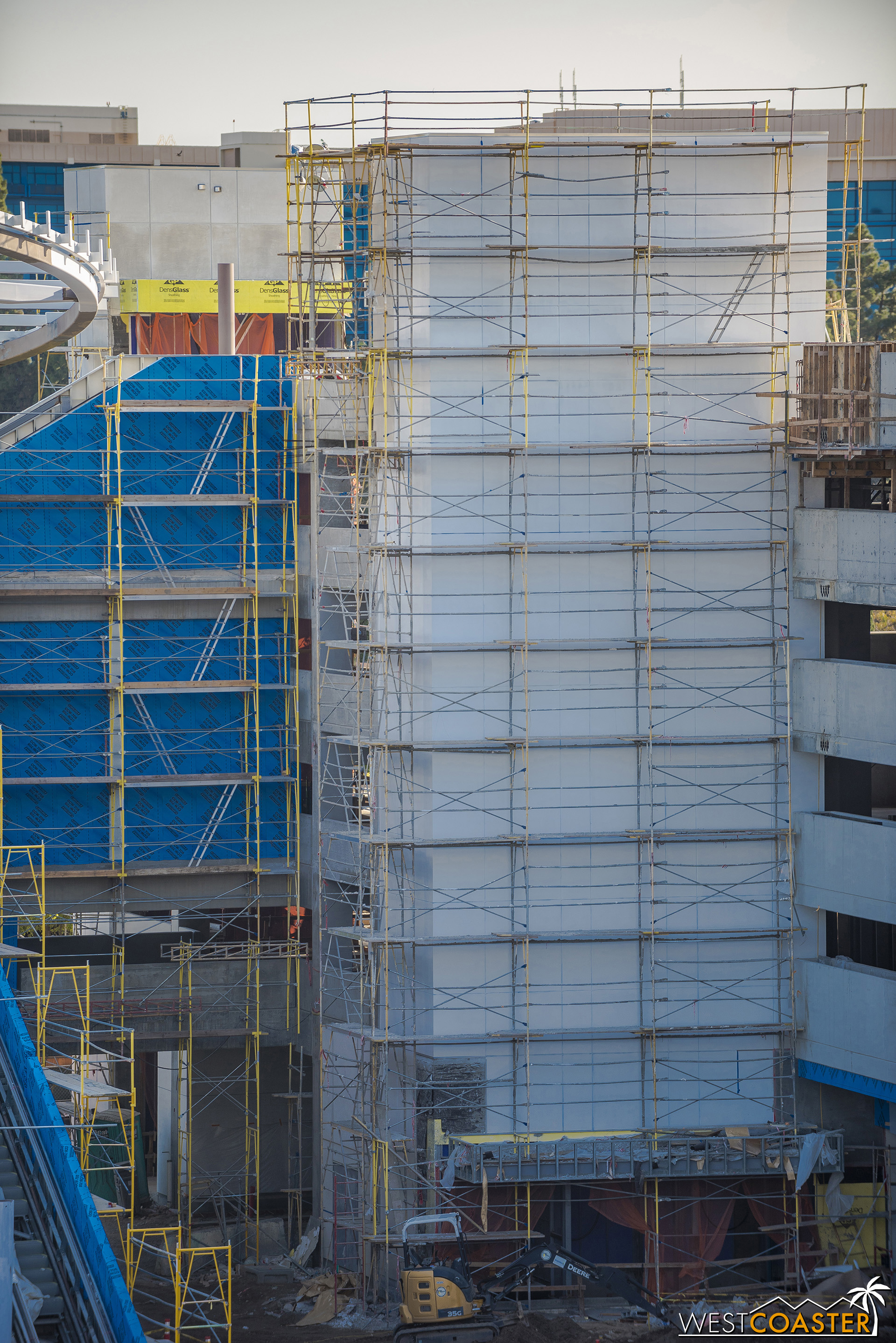  The elevator towers are being wrapped up.  Over in the existing structure, the building material is an aluminum composite metal panel.  But here, it looks like they’re using plaster (stucco) with joints to mimic the panel look! 
