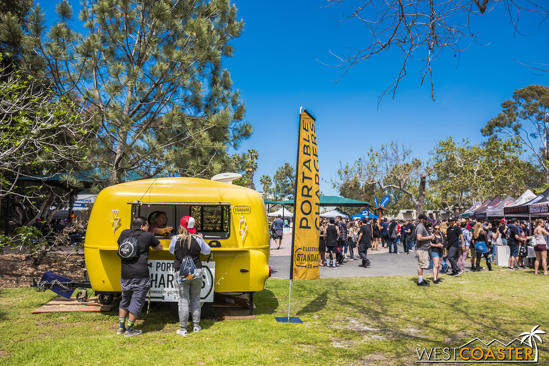  These days, charging stations are a thing at music festivals. 