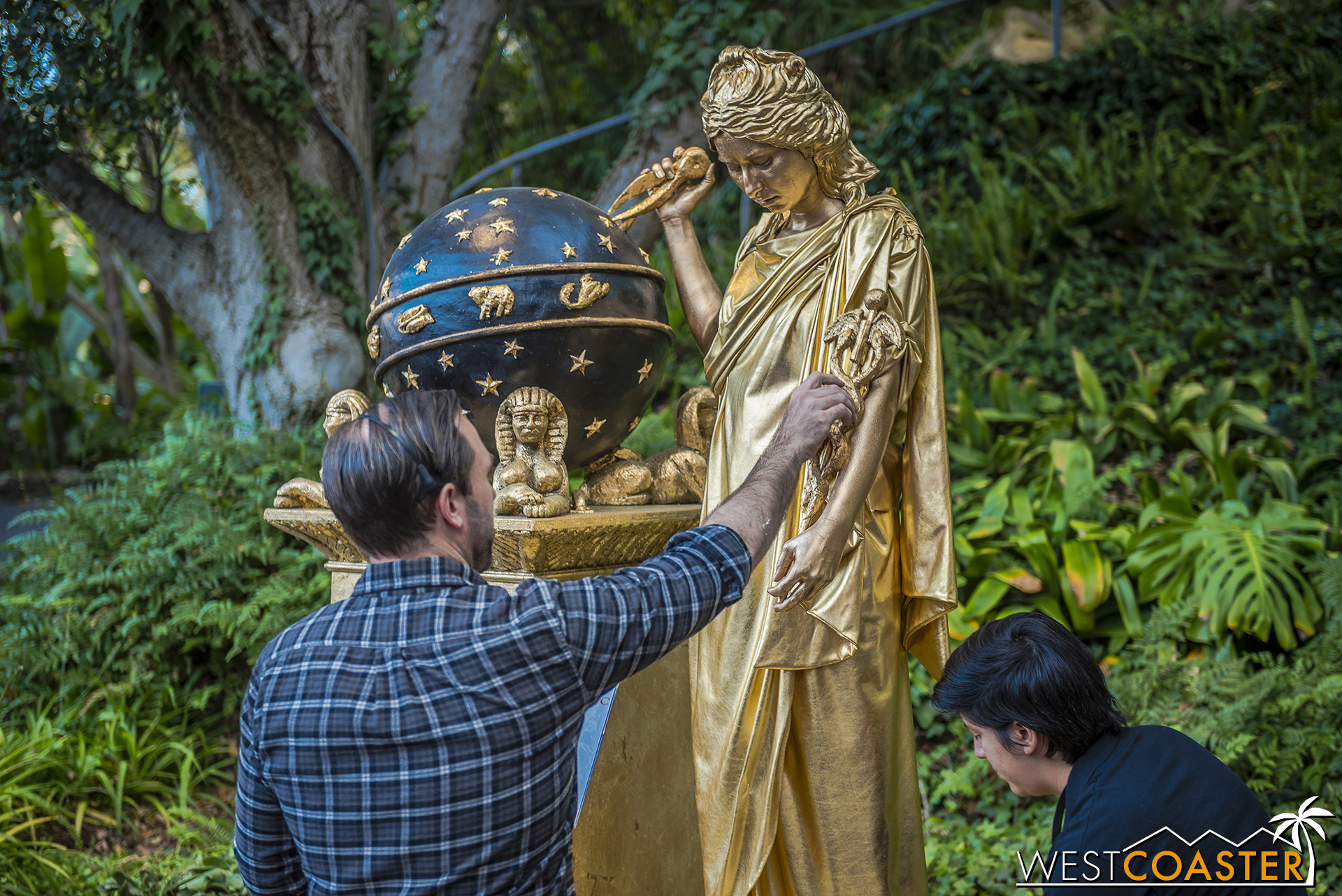  An actress is positioned on the stand of one of the art pieces from this year’s Pageant. 