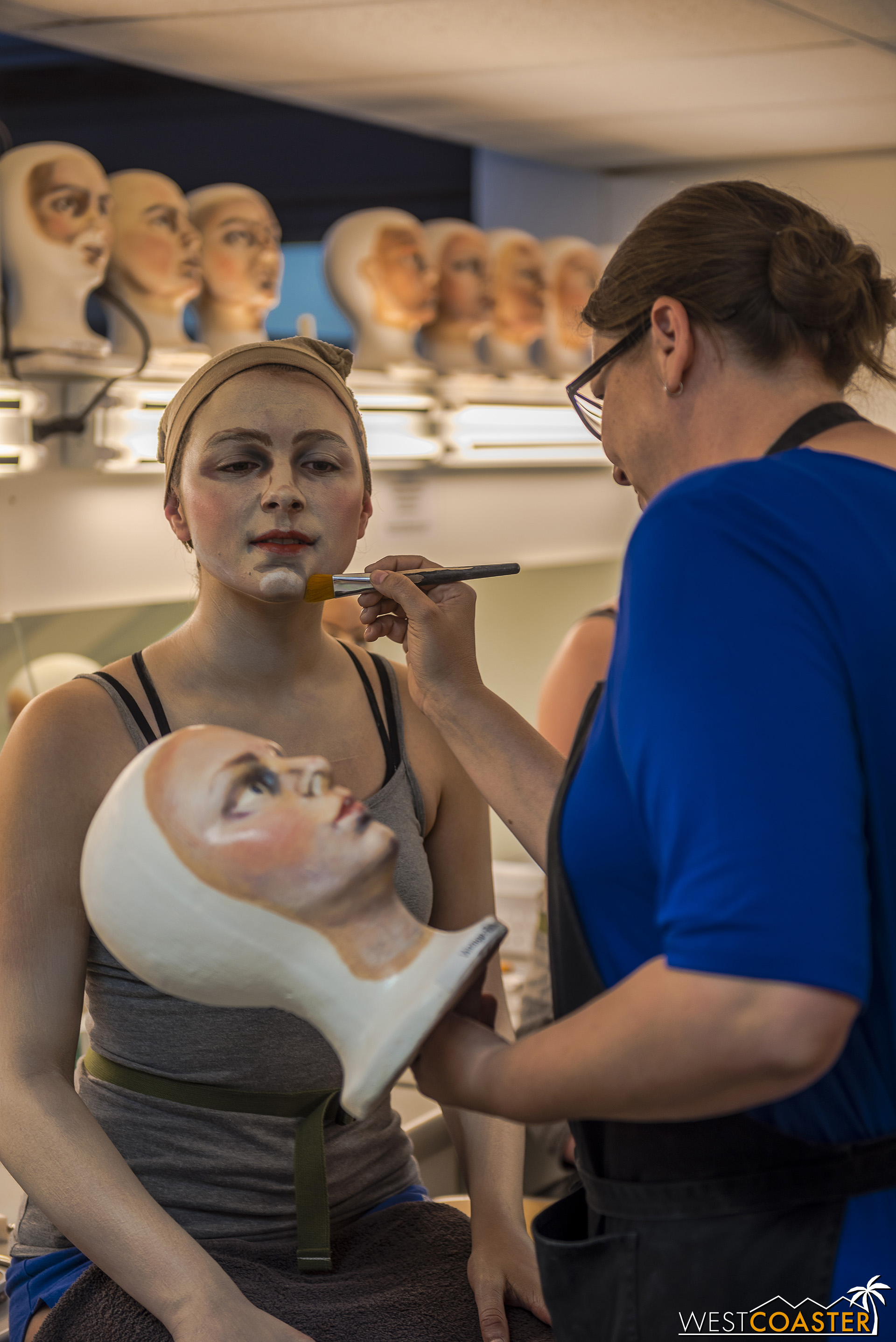  The artists apply makeup on model heads for additional reference, to hone efficiency. 