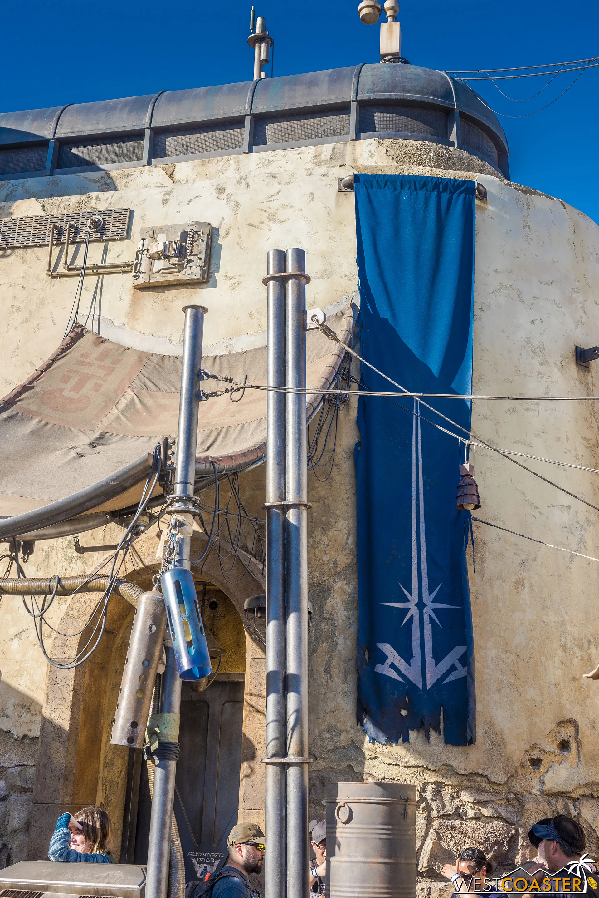 This abstract lightsaber banner is the most overt sign of what’s indoors.