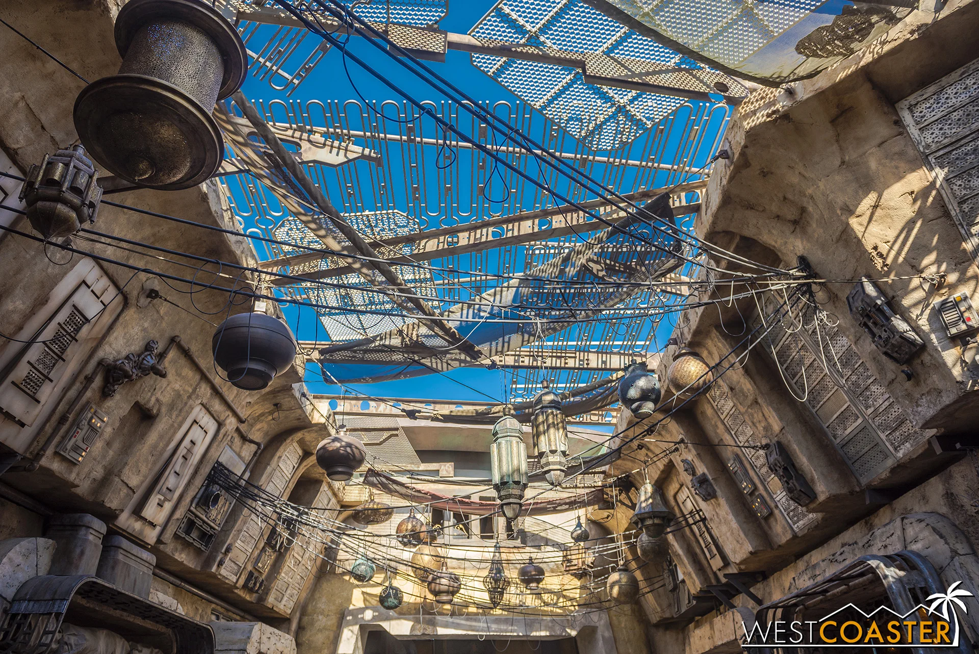 I love the light fixtures and the trellises above.