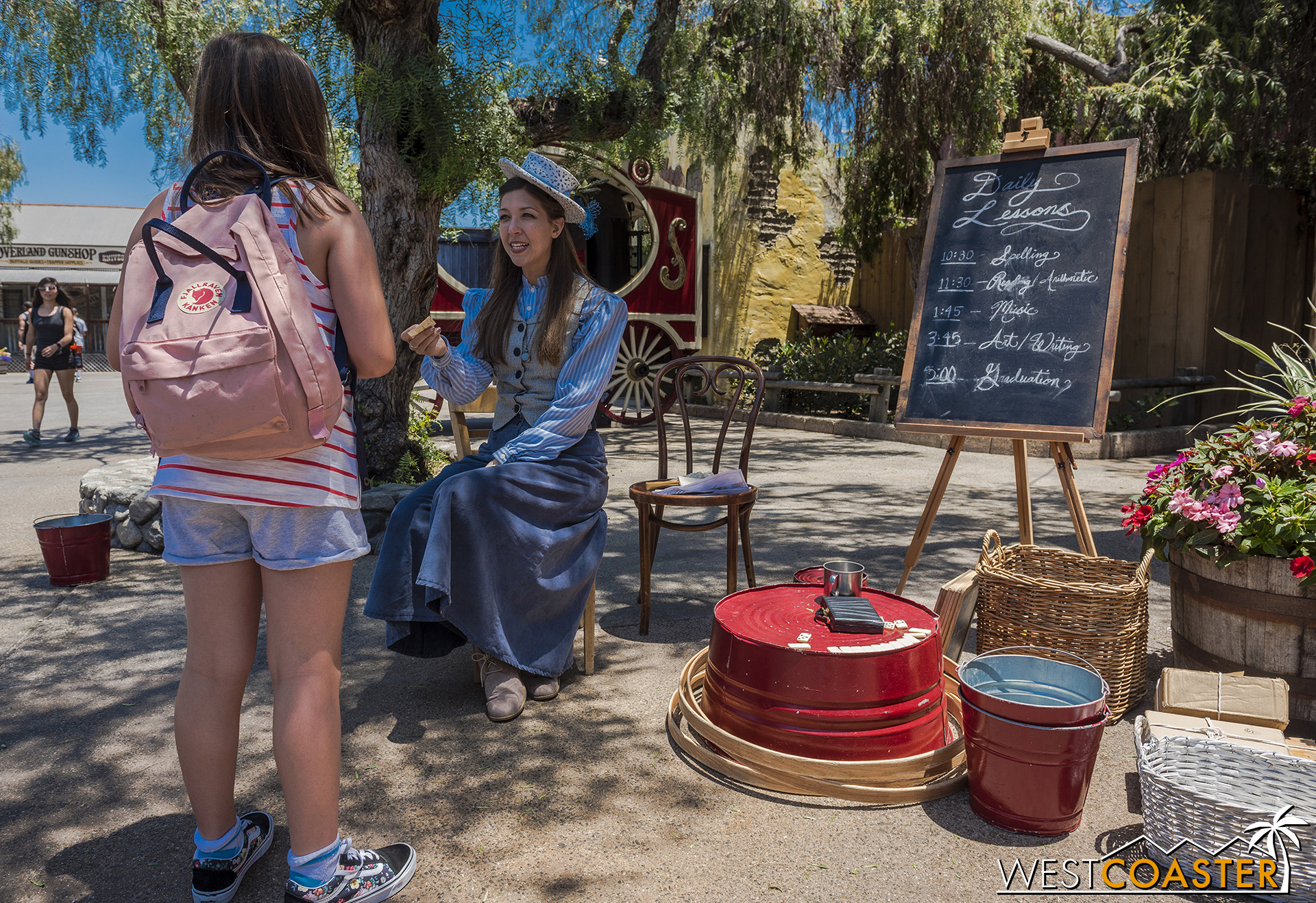  Schoolteacher Miss Sierra Mist chats with a young guest. 