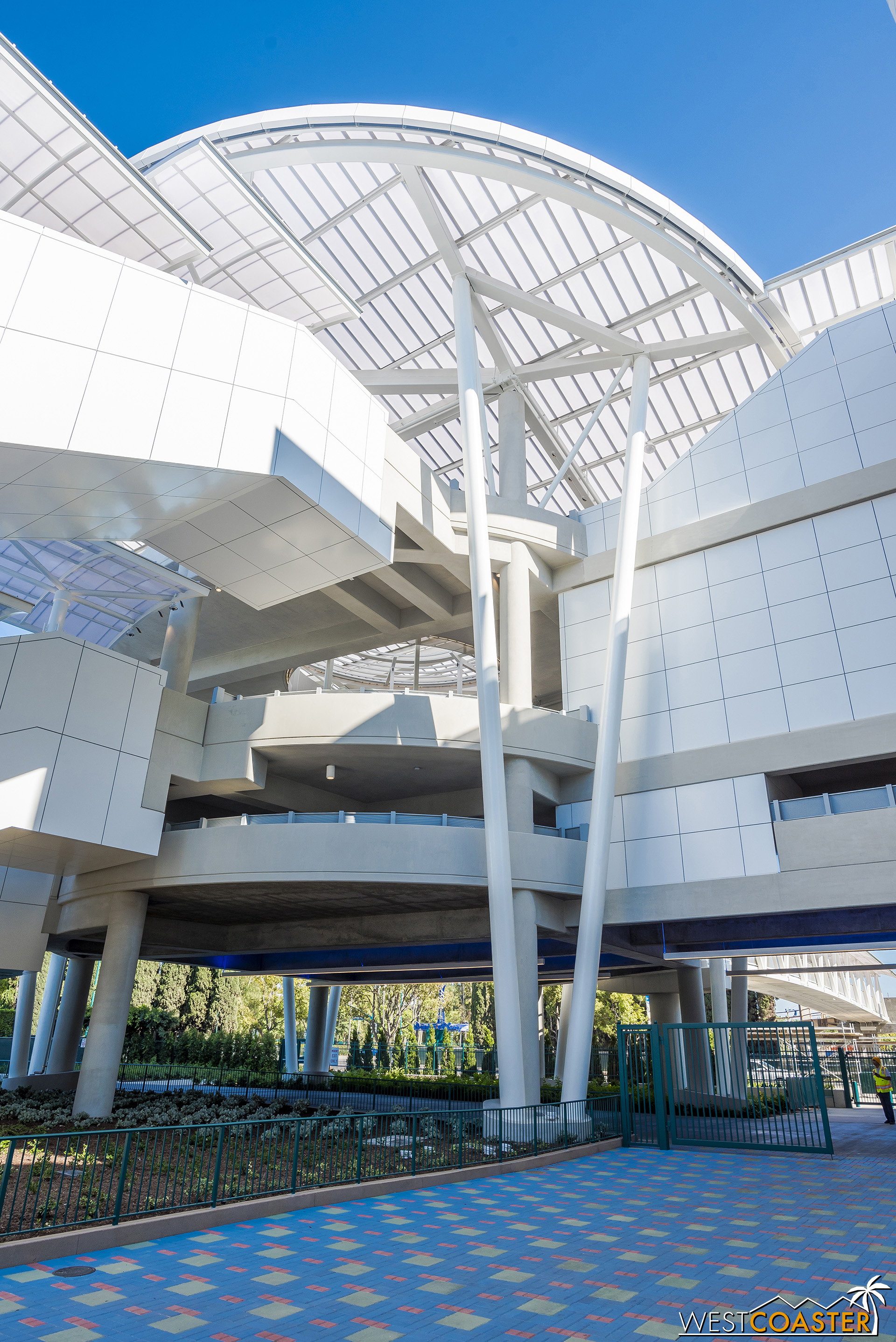  Admore the structure and duck under the bridging esclators to the 6th floor.  You’ll cross the tram route here too. 