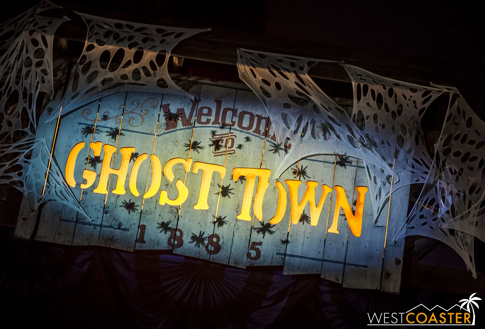 The Ghost Town sign has some new creepy crawly projections this year.