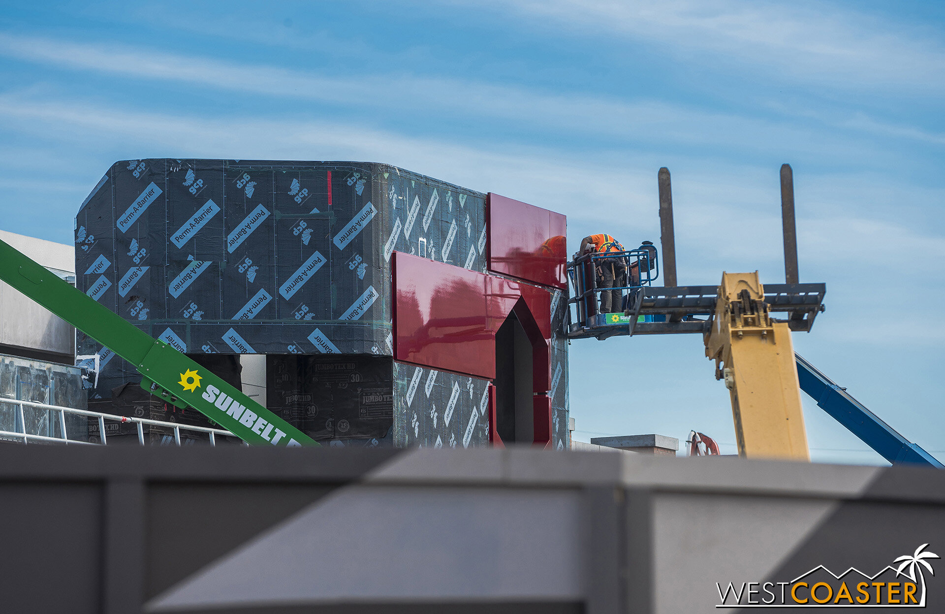  Putting in metal panel at the W.E.B. entry building. 