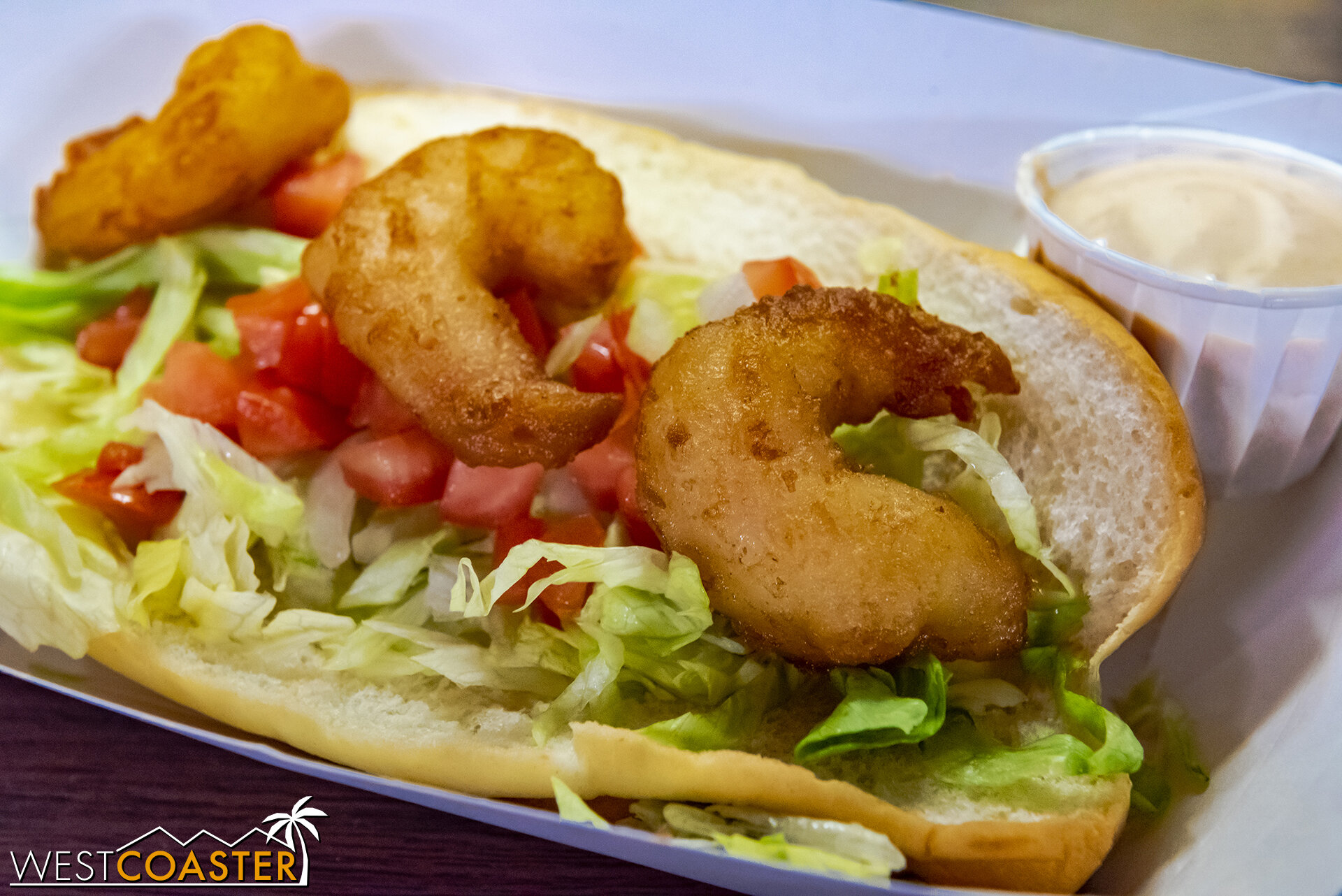  Shrimp Po’ Boy with Shredded Lettuce, Tomatoes, and Chipotle Crema, from Sutter’s Grill. 