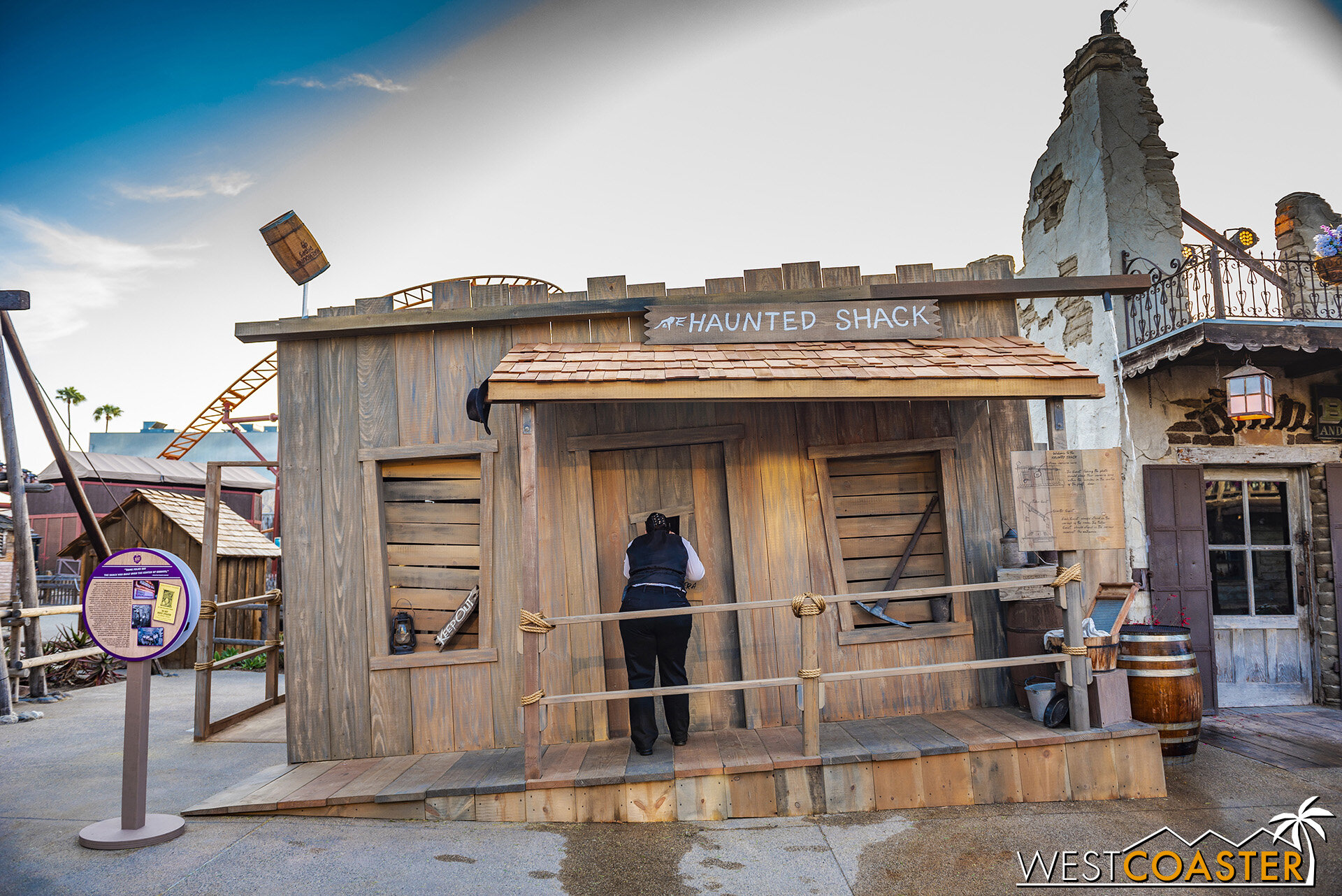  Guests who want to take part in the Haunted Shack photo op enter off the left.  But the person taking the photo stands in front of the door in the center. 