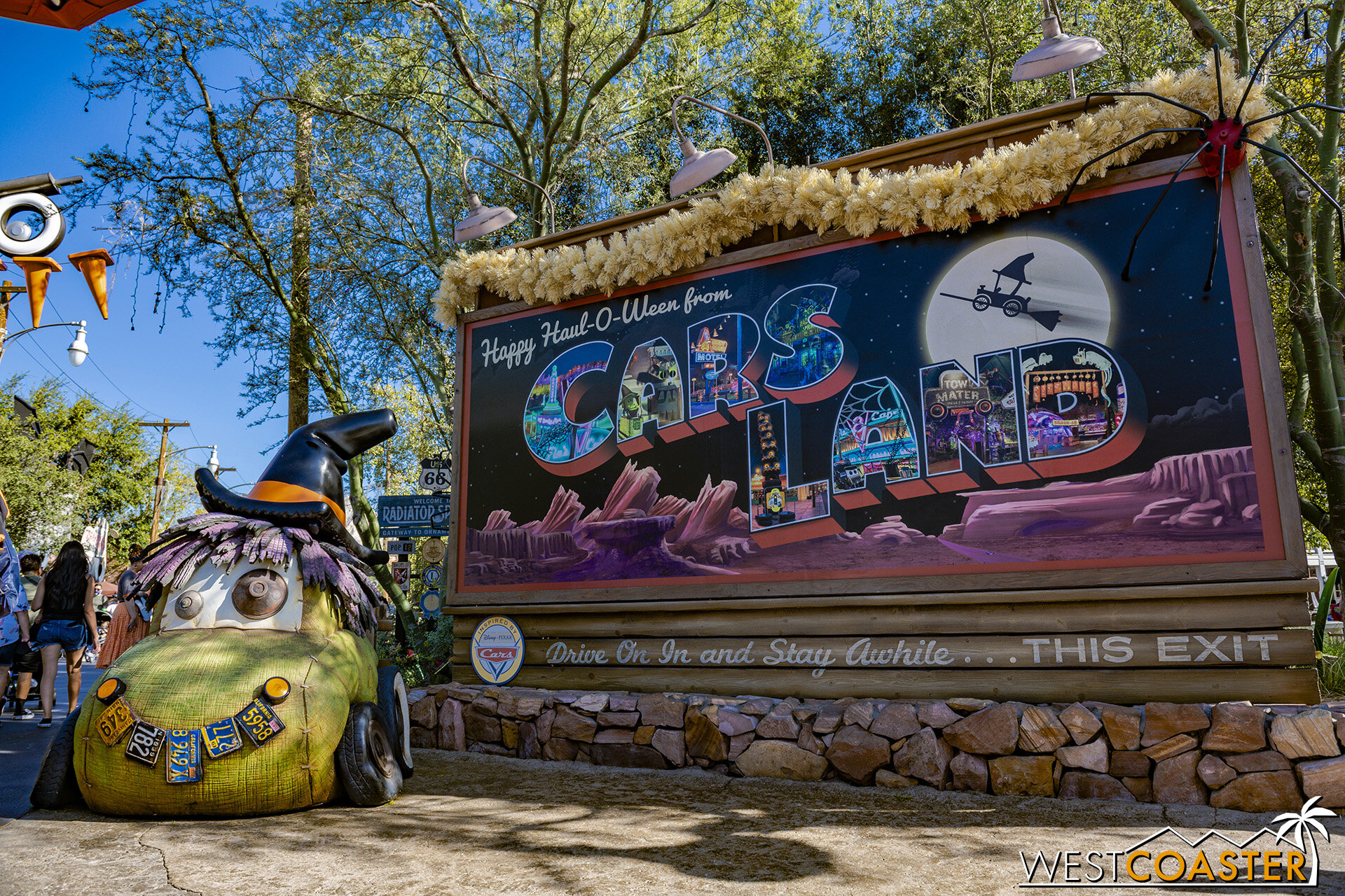  Onto Cars Land, where a witchy scarecar poses in front of the seasonal welcome sign. 