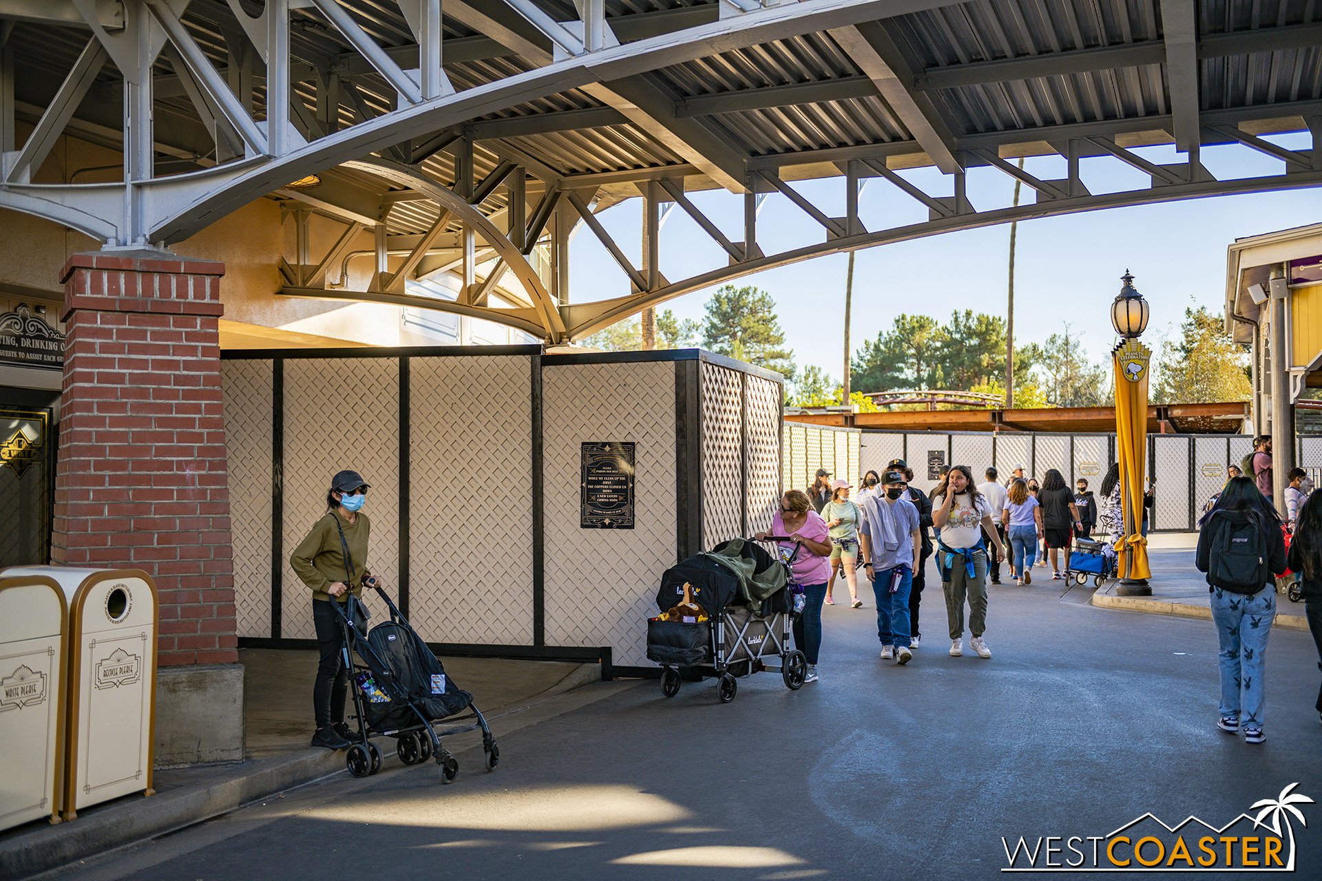  Construction walls are up from the lower entrance into the Charles Schulz Theater all the way to the railroad tracks. 