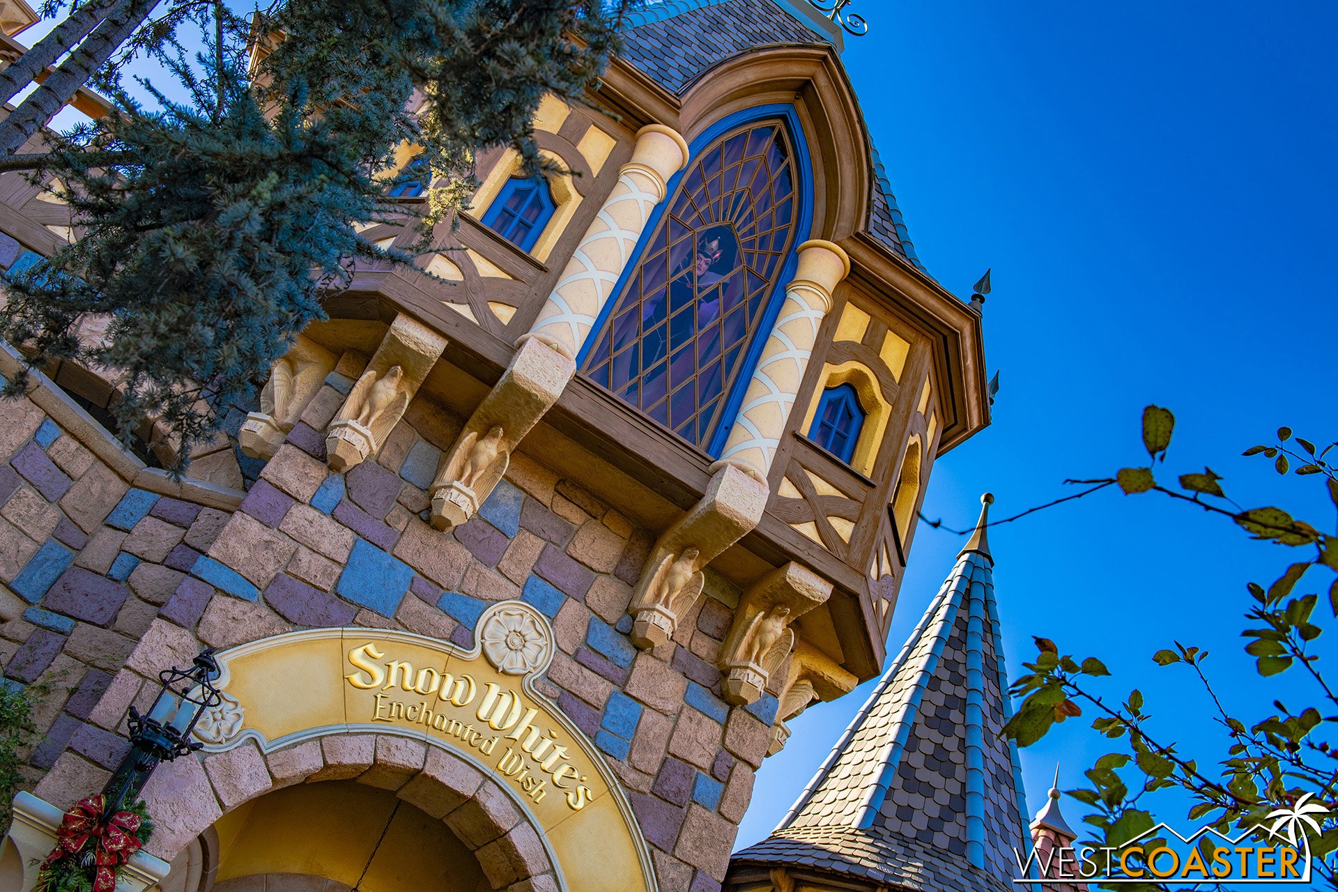  The exterior of the Snow White attraction has been given more color to blend more with the castle. 