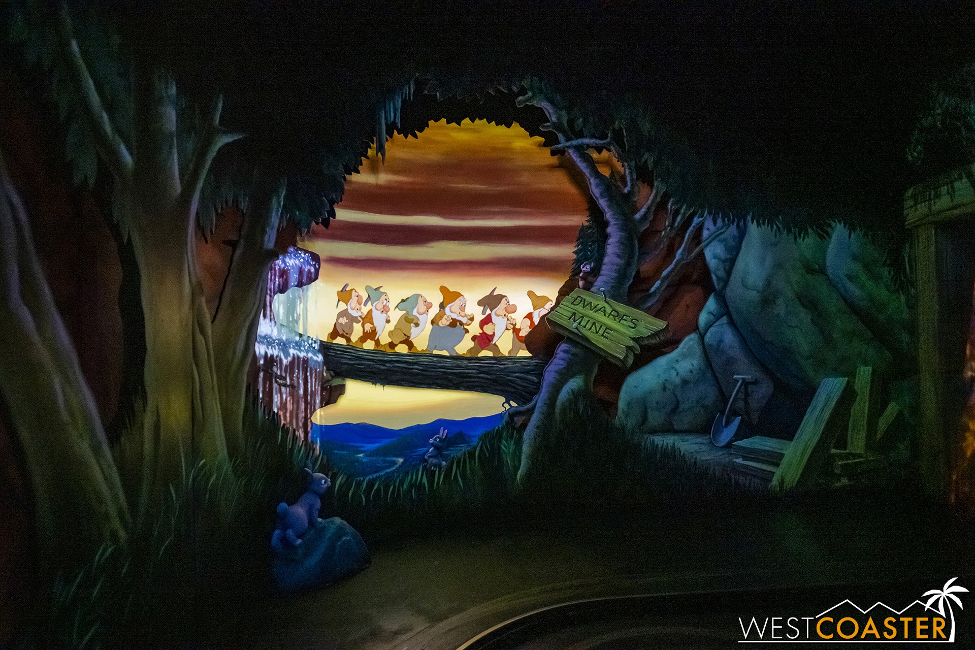  Leaving the cottage, guests follow the dwarfs to their mine.  The projection here is similar to the enhancement at the Alice in Wonderland ride several years ago. 