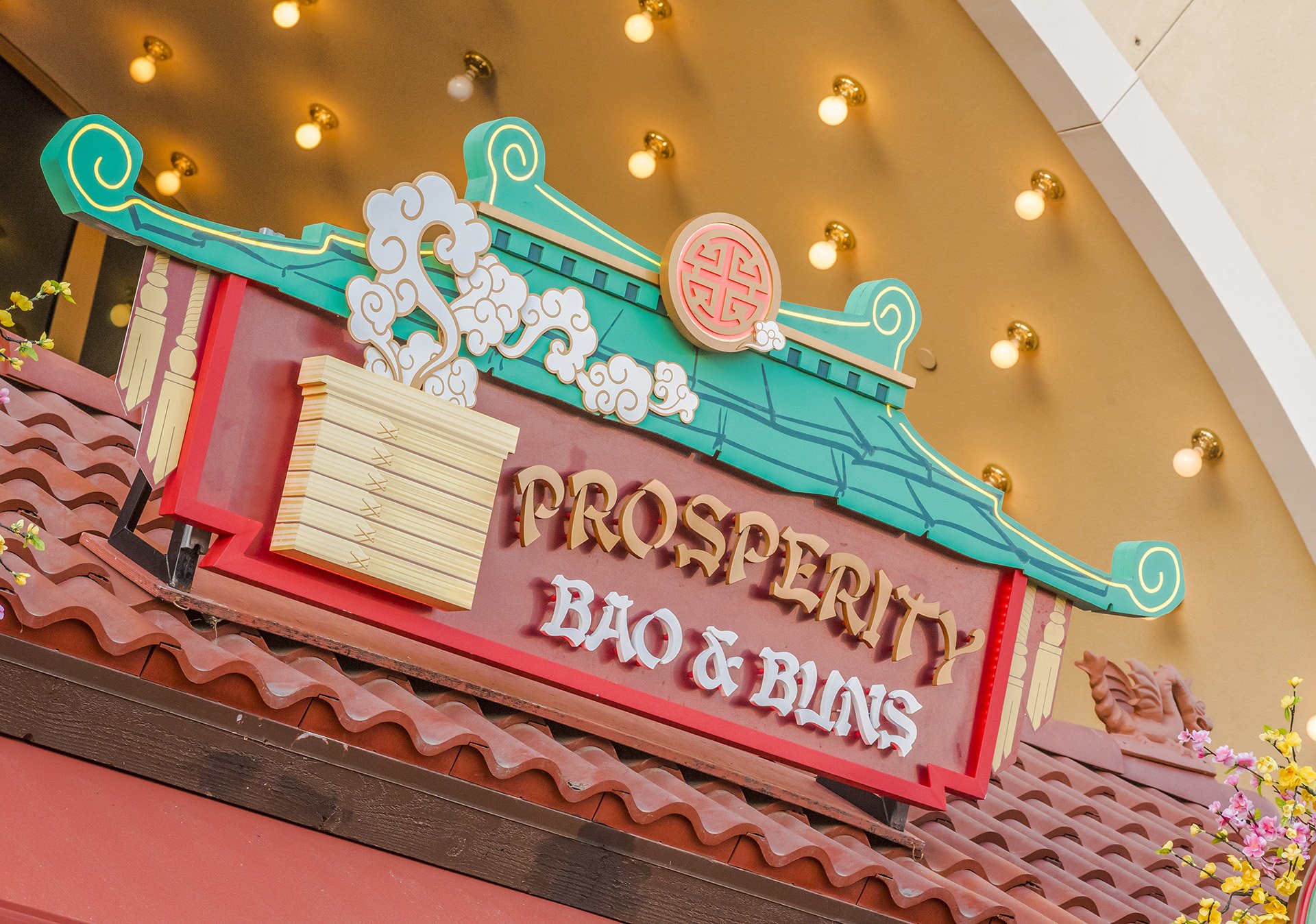  Prosperity Bao &amp; Buns is in front of the center of the Little Mermaid ride building. 