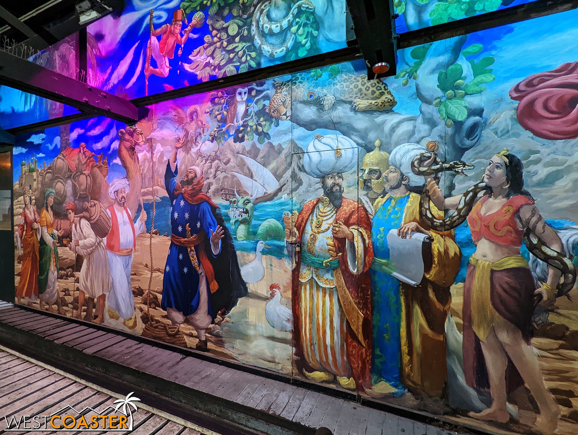  At the loading station, there is a beautiful mural that stretches the length of the platform! 