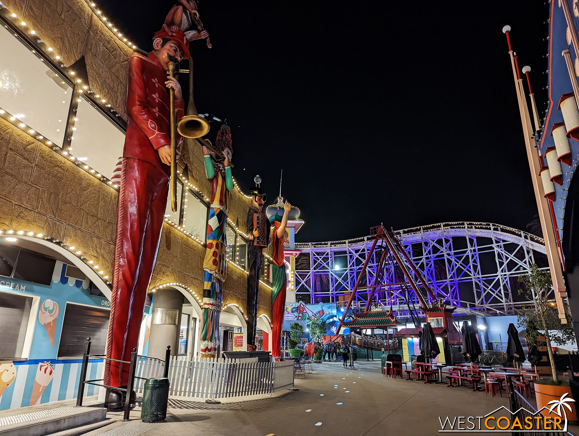  The swinging pirate ship ride, Twin Dragon, stands parked in the distance. 