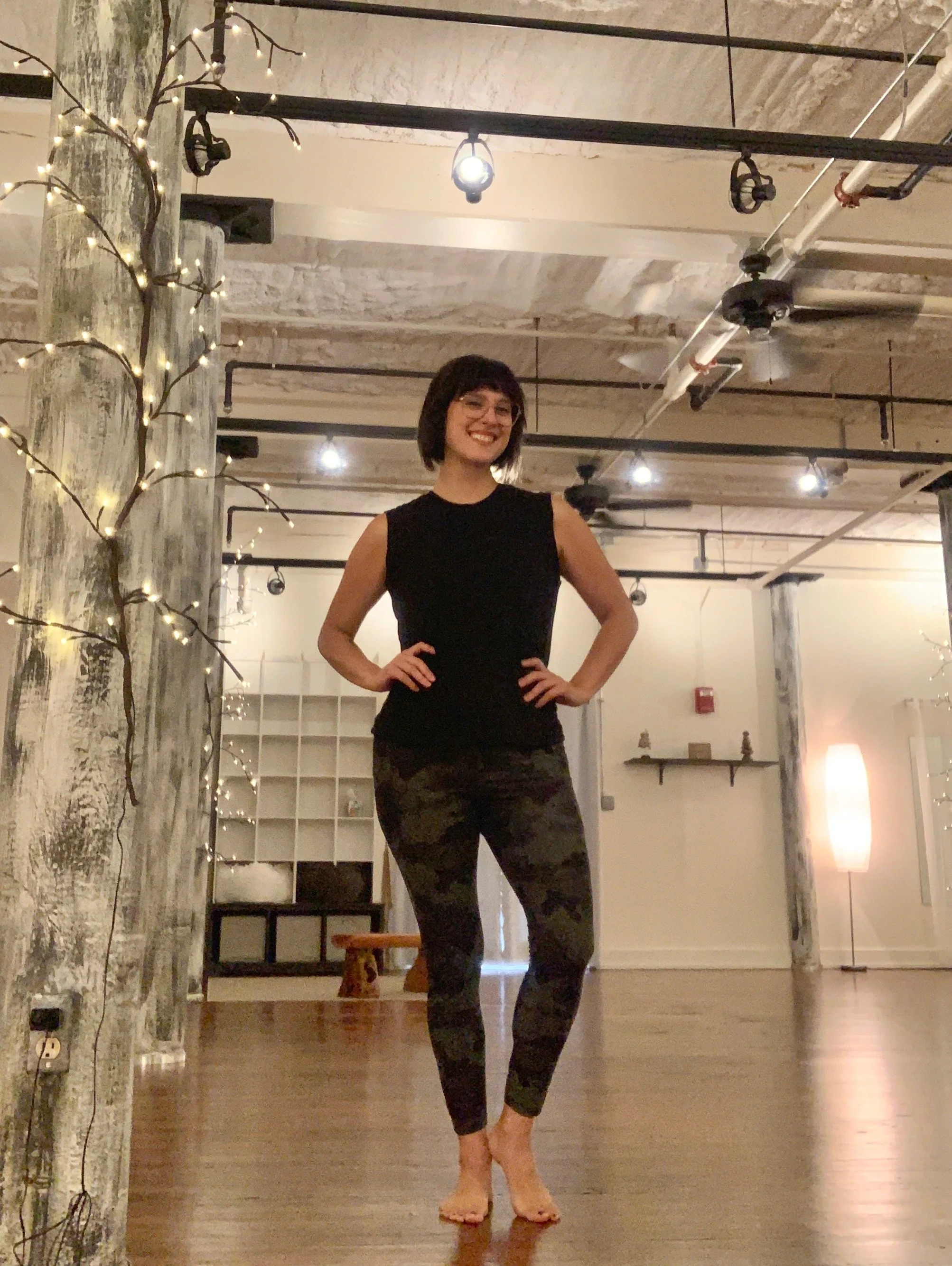 Amanda standing in yoga room .JPEG