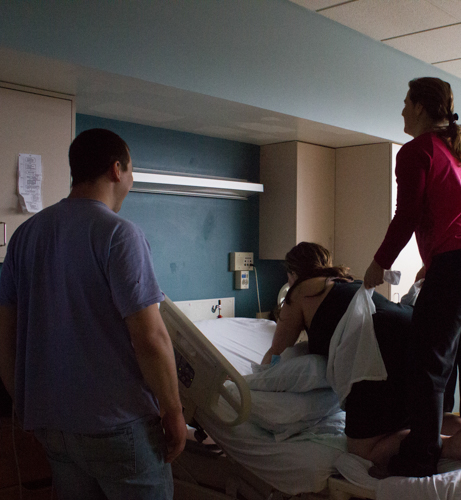 Back in the room I suggested then demonstrated forward leaning to relive back pain and belly lifting to get baby up to drop into the pelvis. I tried a couple of positions with her to find what felt best and what was most productive.