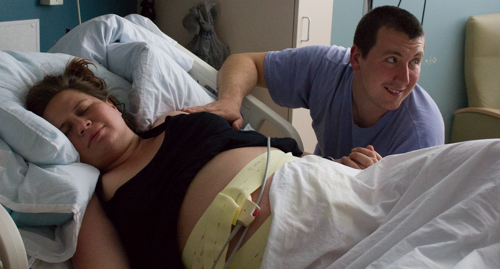 A doula supported father is getting excited. They are getting close!