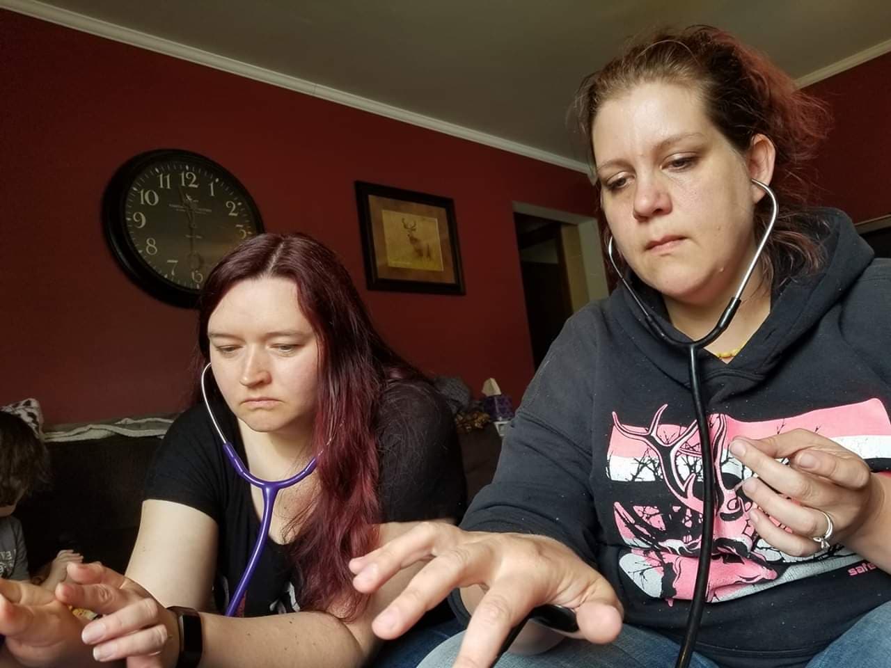 Traditional Midwives Lisa Suffrage and Denise Hibben using two manual fetoscopes in order to confirm twins in their client. Most other midwives wouldn’t attend twin deliveries at home either by regulation or by choice and rely on ultrasound scans for diagnosis.