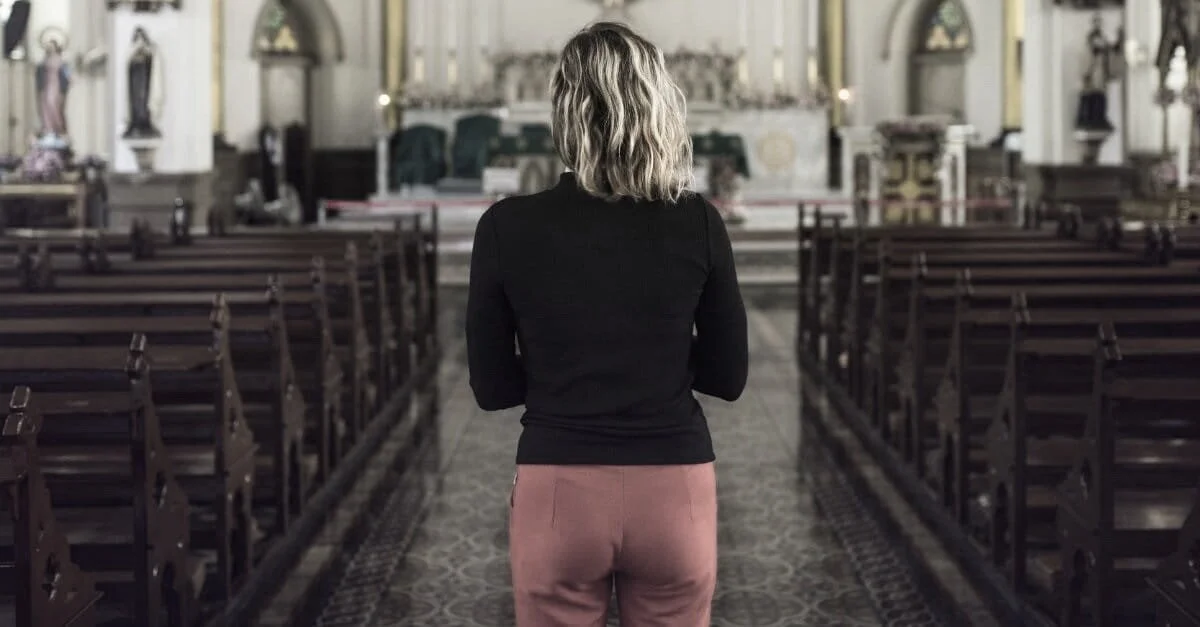 46670-woman-standing-in-church-1200.1200w.tn.jpg