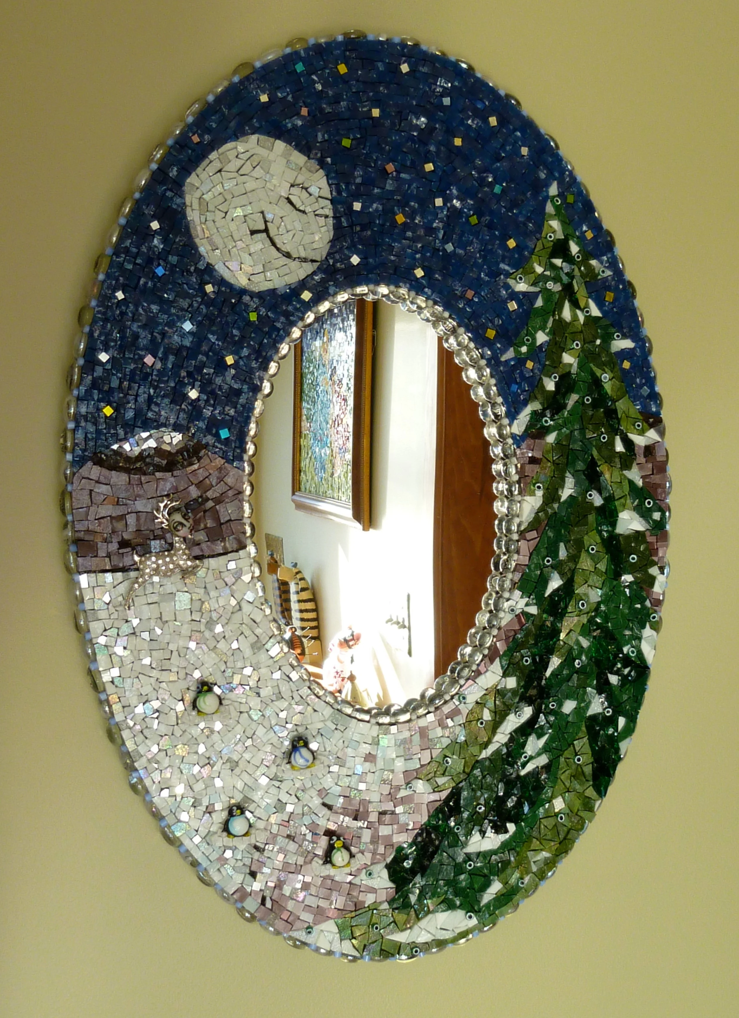 I built this piece around the reindeer on the left created by Michele Lynche. Made os smalti and fused glass.