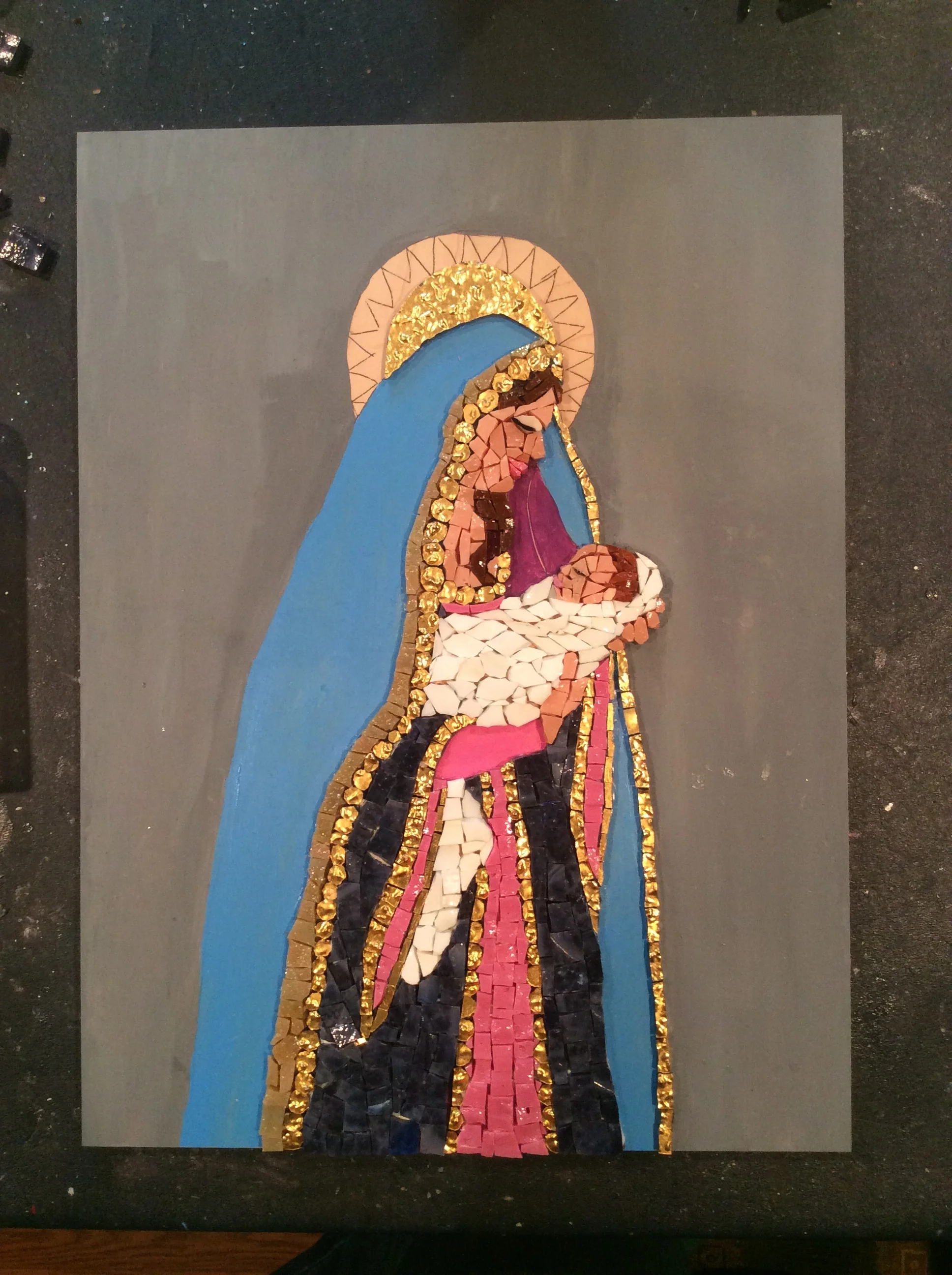 Another 5 hours of work. I have just enough purple smalti to finish the Madonna's dress. 