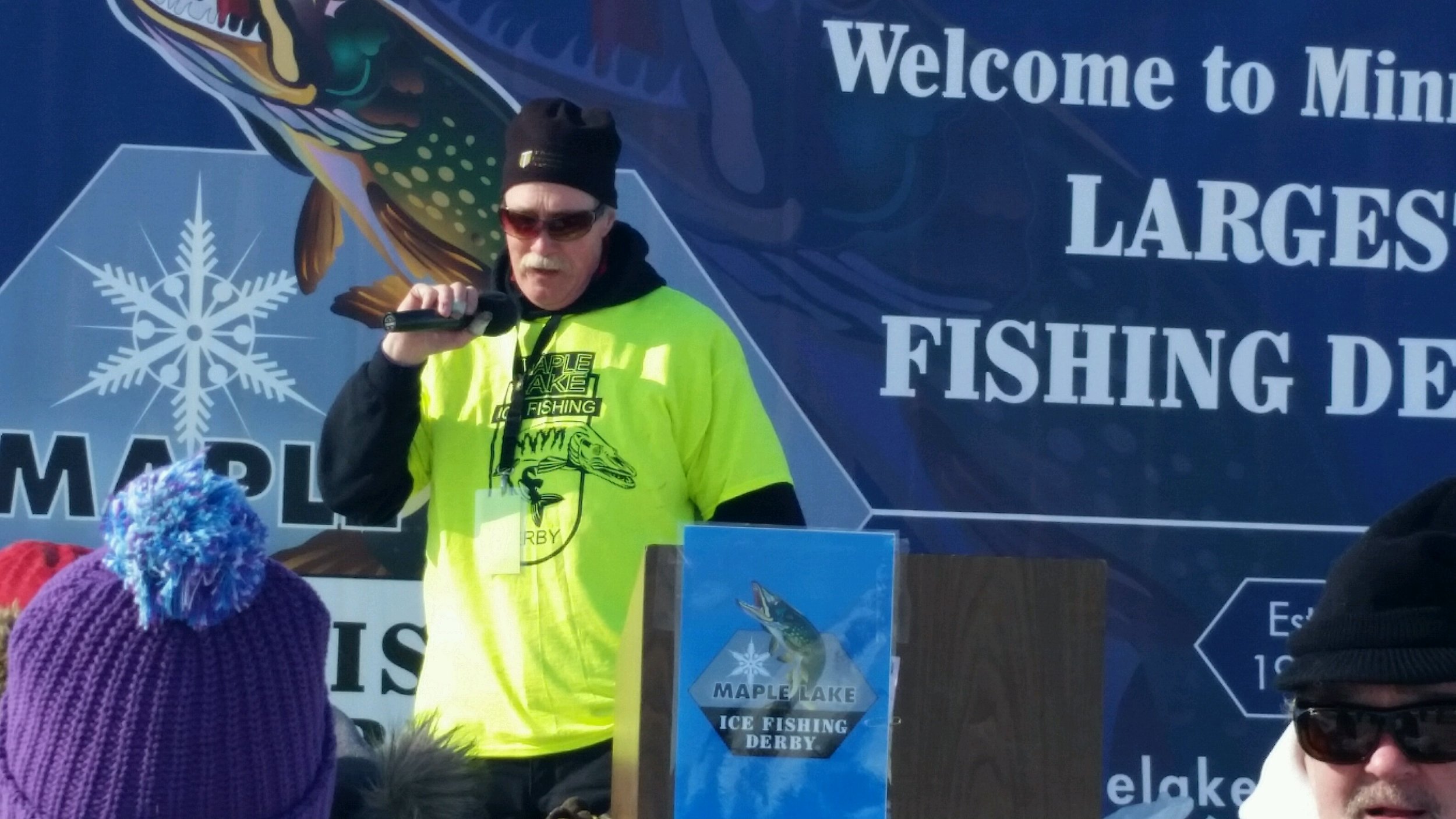 Greg Thomes announcing at Maple Lake Ice Fishing Derby