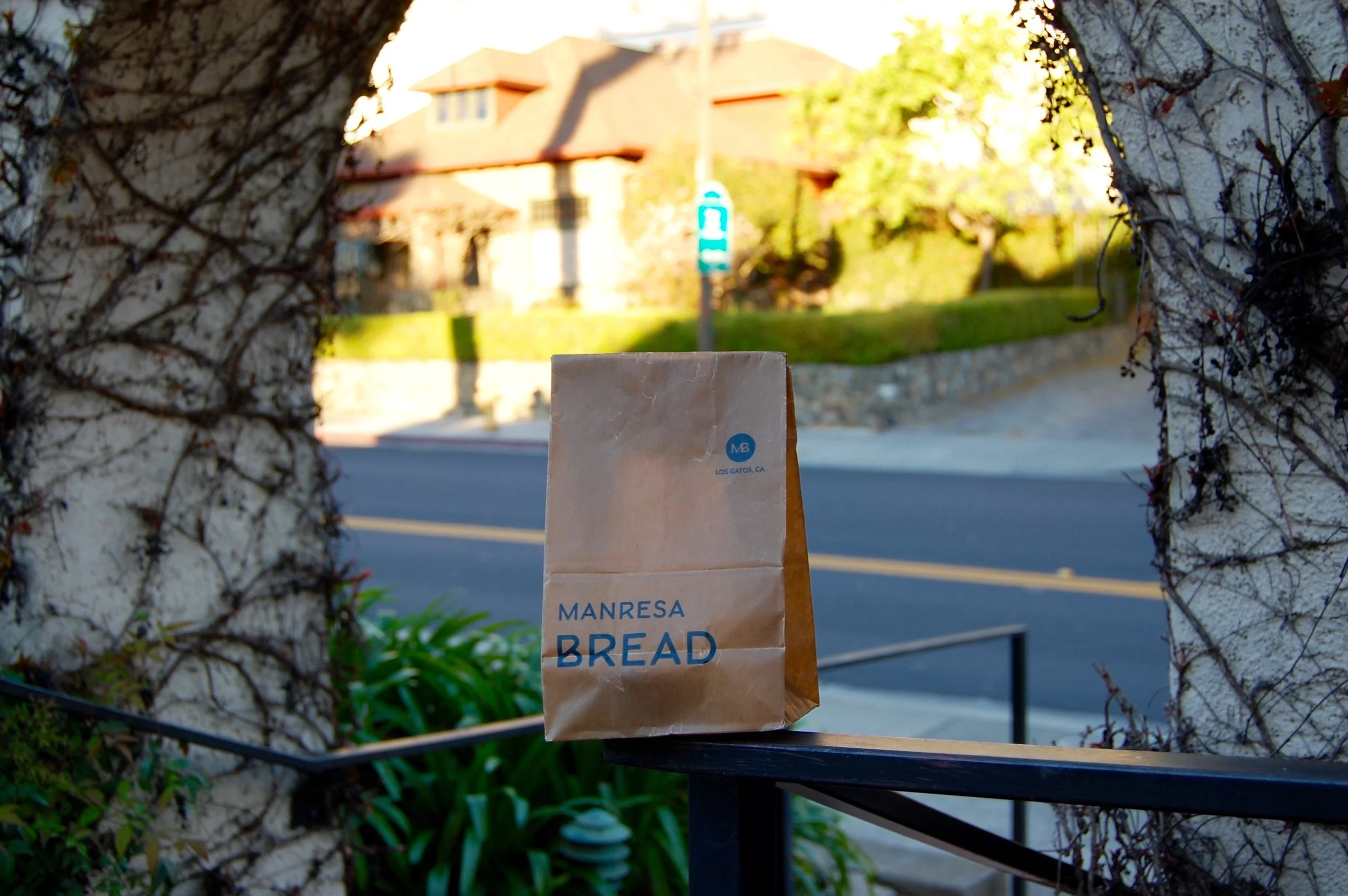 Even the waxed paper bag was beautiful. Hidden within: my mysterious Kouign Amann.